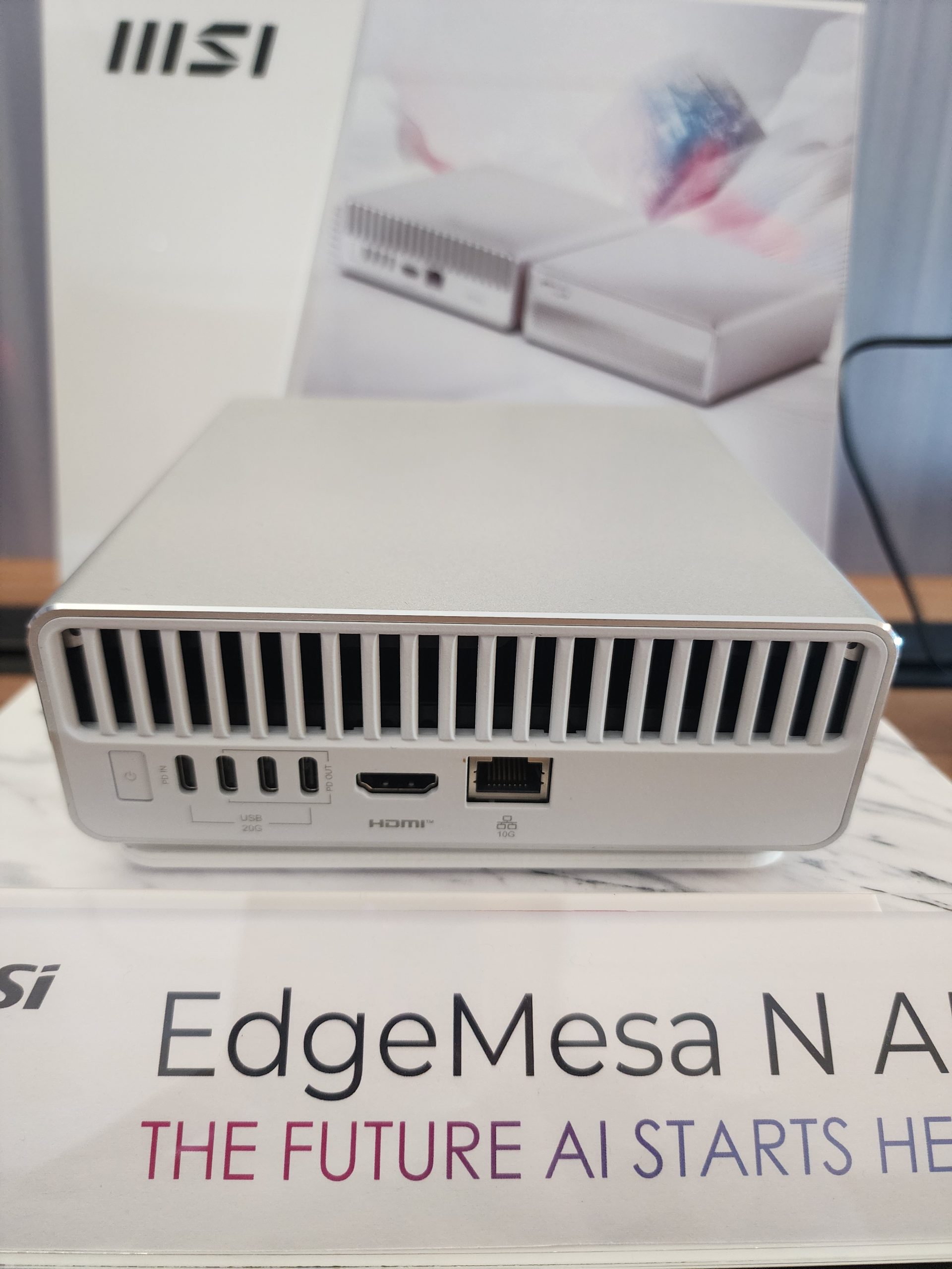 An MSI EdgeMesa N AI device is displayed with visible ports including USB, HDMI, and Ethernet, along with the text 'THE FUTURE AI STARTS HERE'.