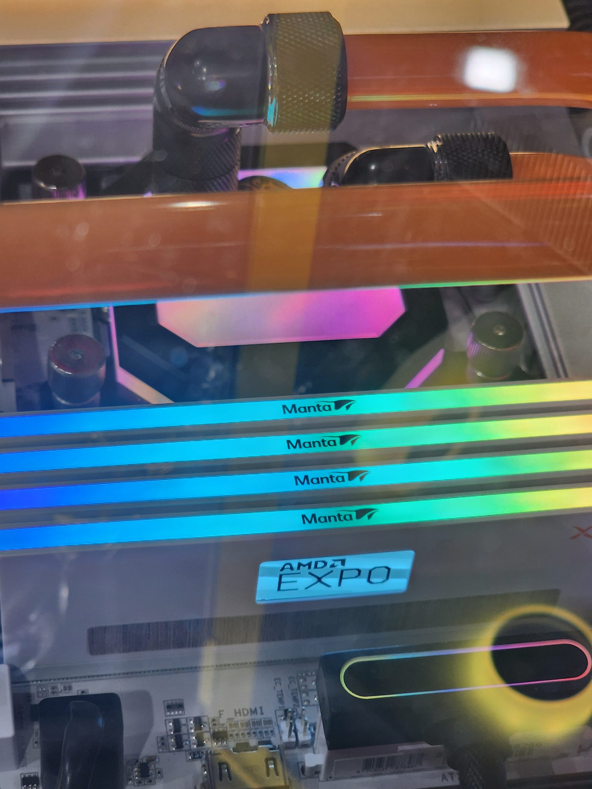 Four Manta RGB RAM sticks are installed on a motherboard with 'AMD EXPO' visible.