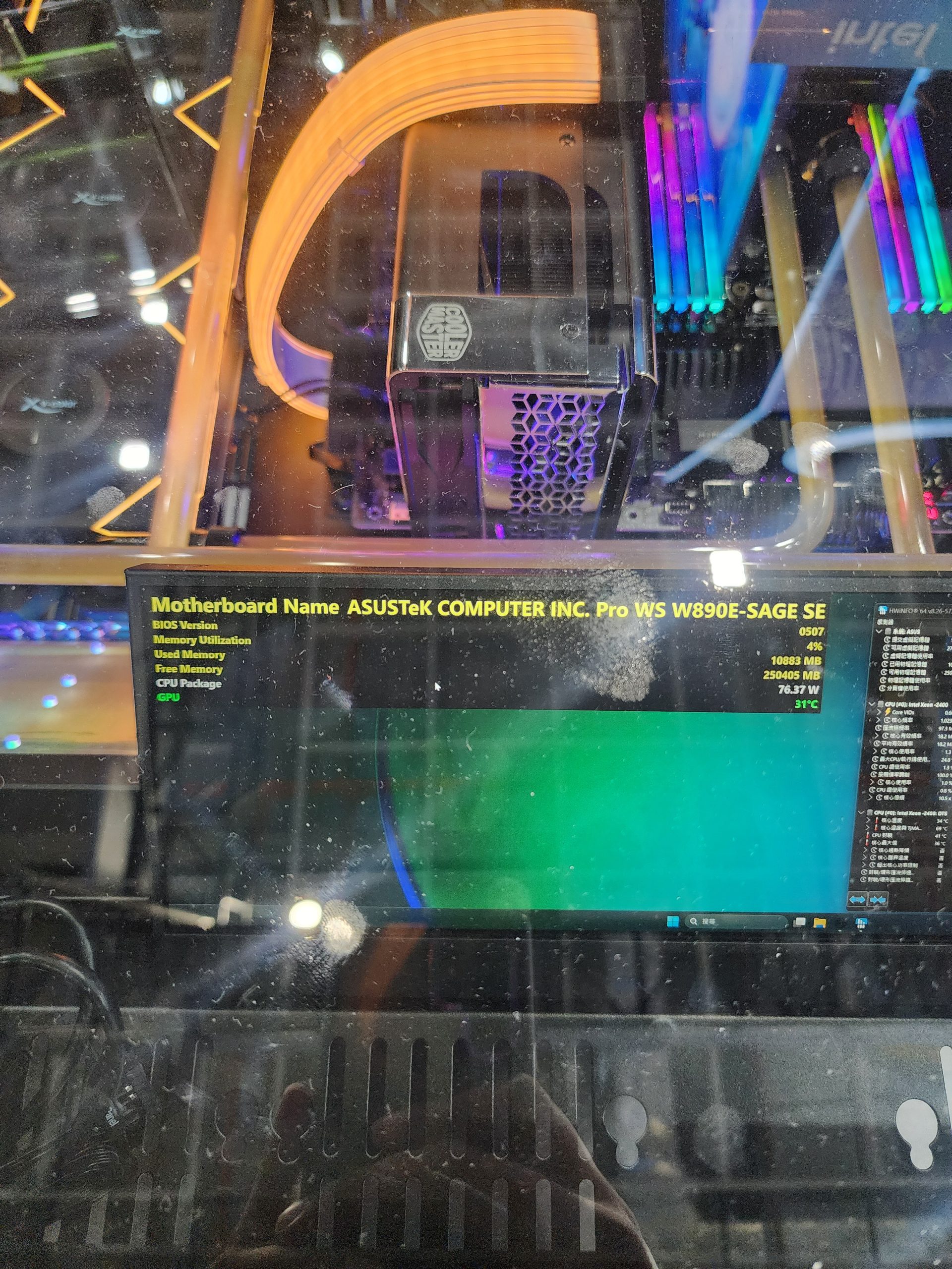 A visible computer setup features a Cooler Master component and RGB-lit RAM, with a screen displaying 'Motherboard Name ASUSTeK COMPUTER INC. Pro WS W890E-SAGE SE BIOS Version' and system details.