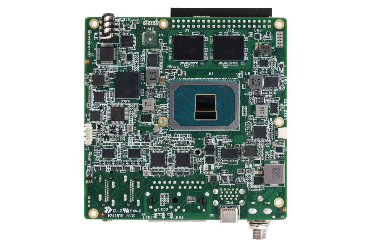 A close-up of a green circuit board featuring a central Intel chip with multiple capacitors and connectors.