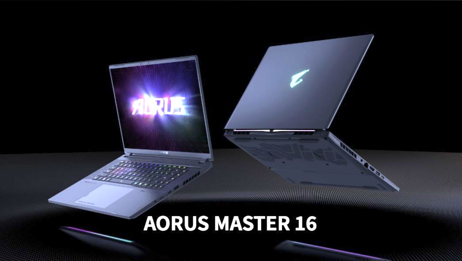 Two laptops displaying the AORUS logo and branding, with text 'AORUS MASTER 16' at the bottom.