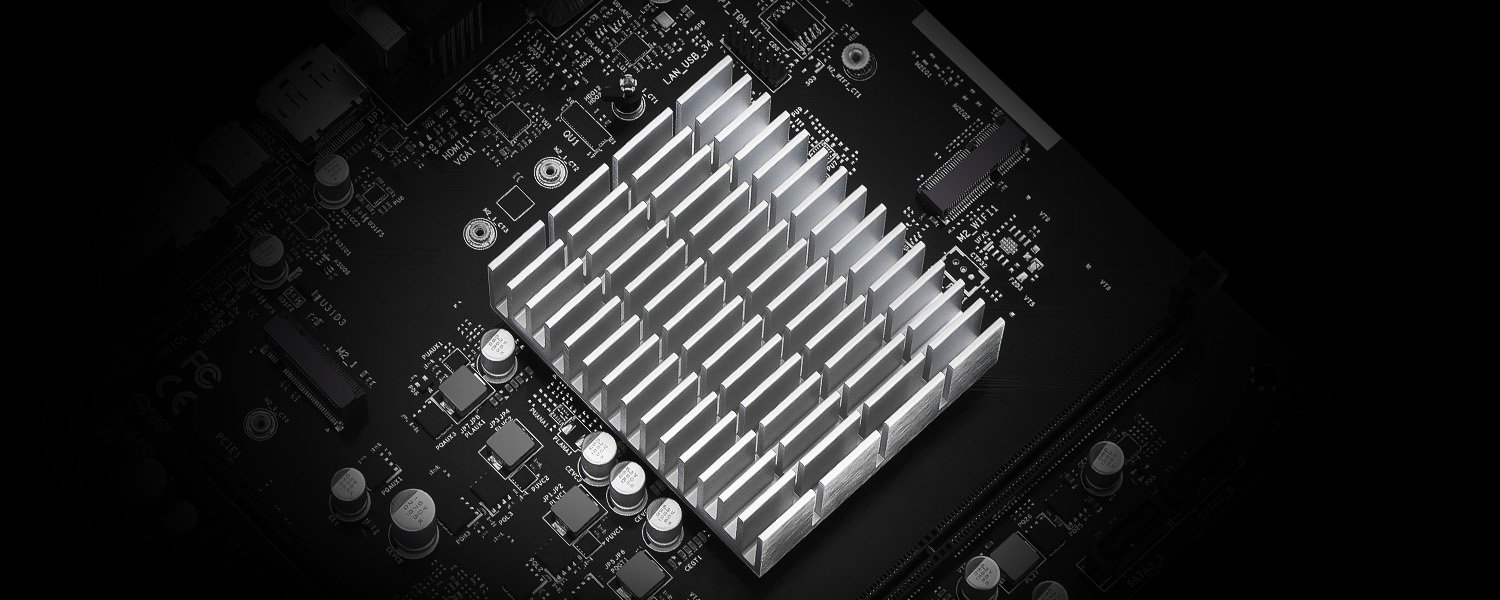A close-up of a motherboard featuring a large aluminum heatsink surrounded by various capacitors and labeled ports such as 'HDMI' and 'VGA1'.