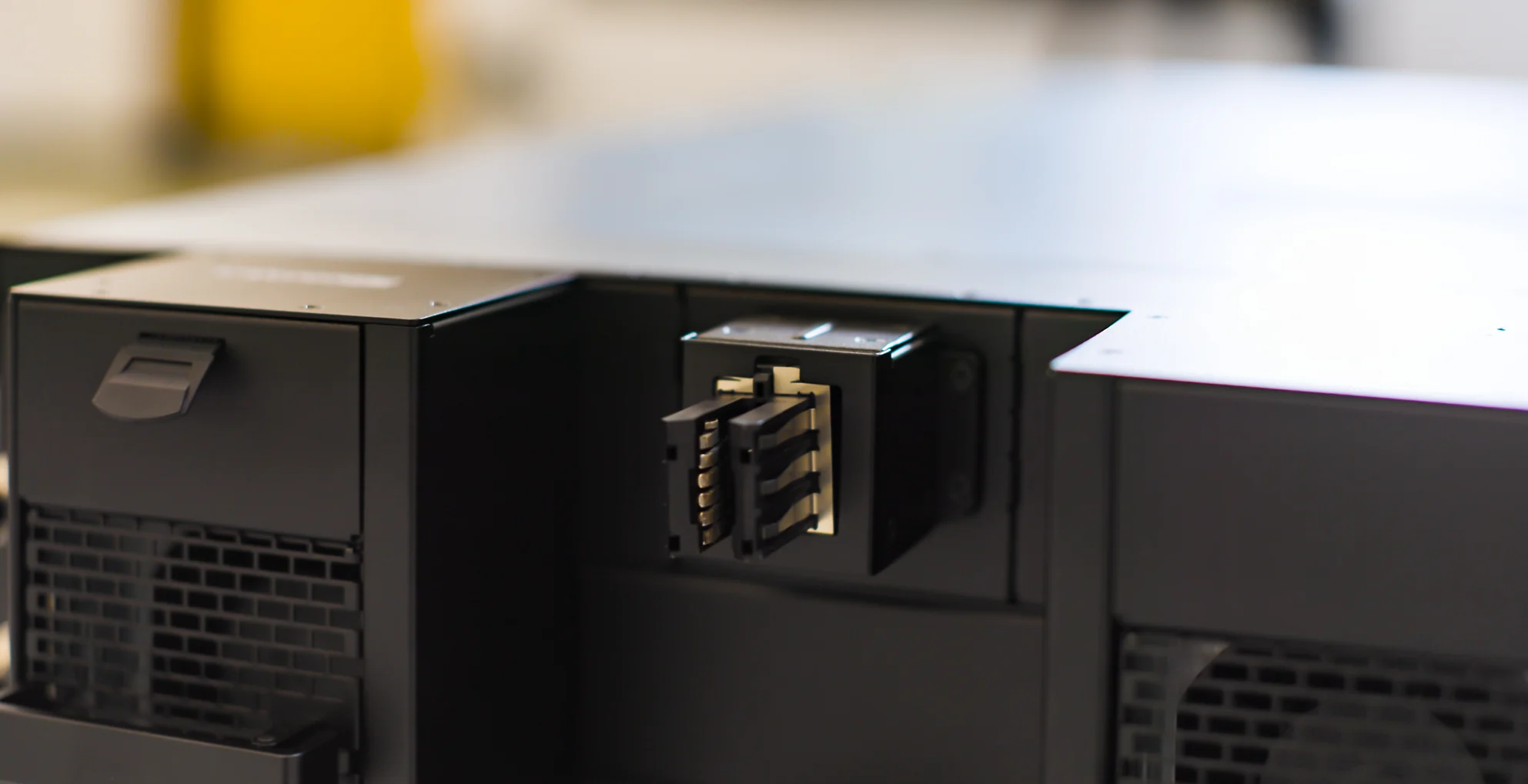A close-up of an NVIDIA data center unit with a large-scale connector exposed.