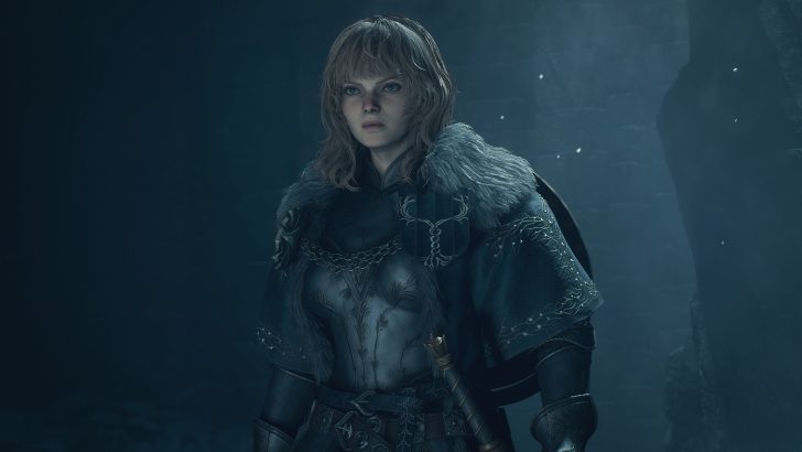 A character in a medieval setting wearing detailed armor and holding a sheathed sword.