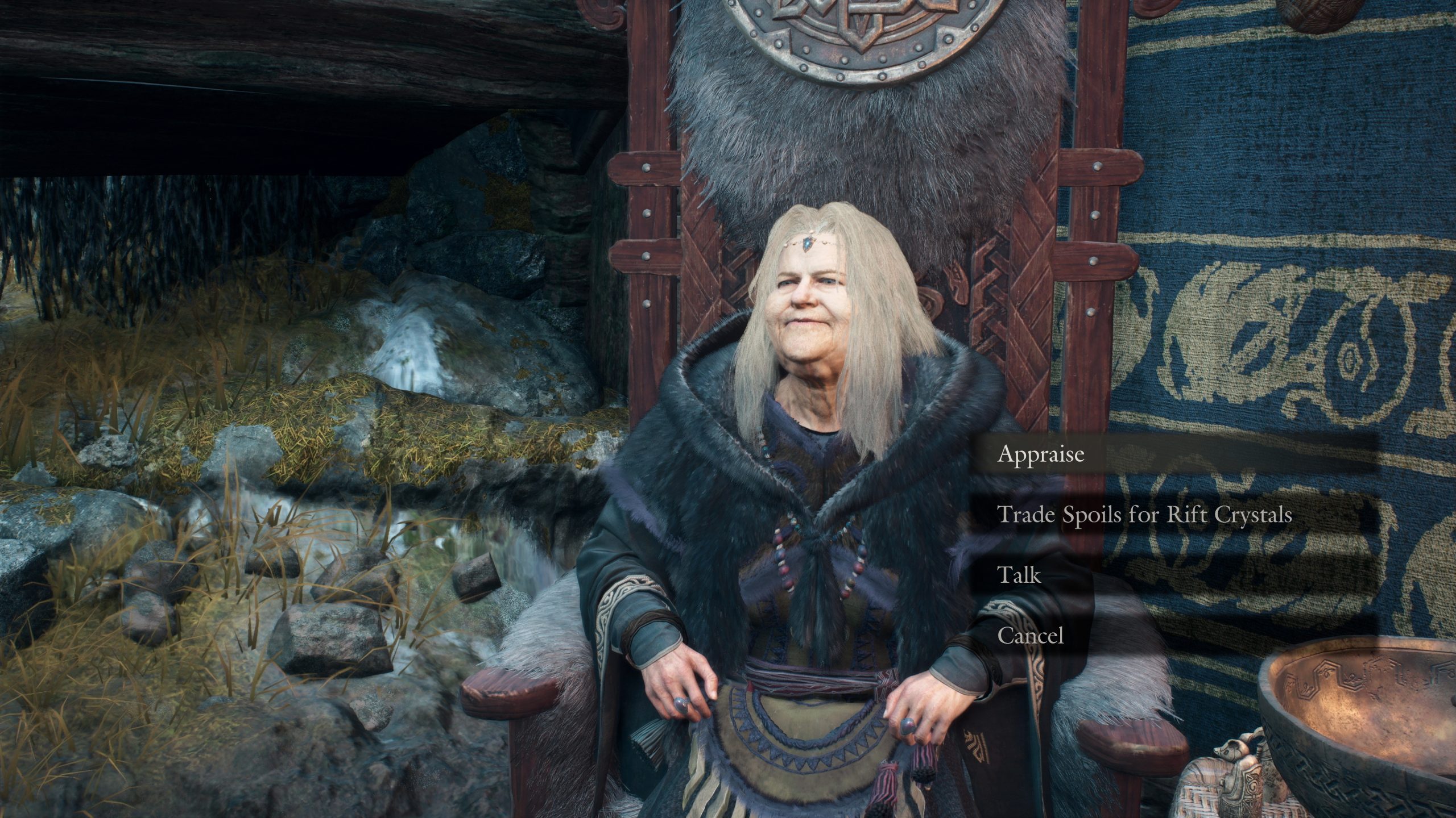 An elderly woman is seated on a throne-like chair in a game setting, with options on-screen including 'Appraise' and 'Trade Spoils for Rift Crystals.'