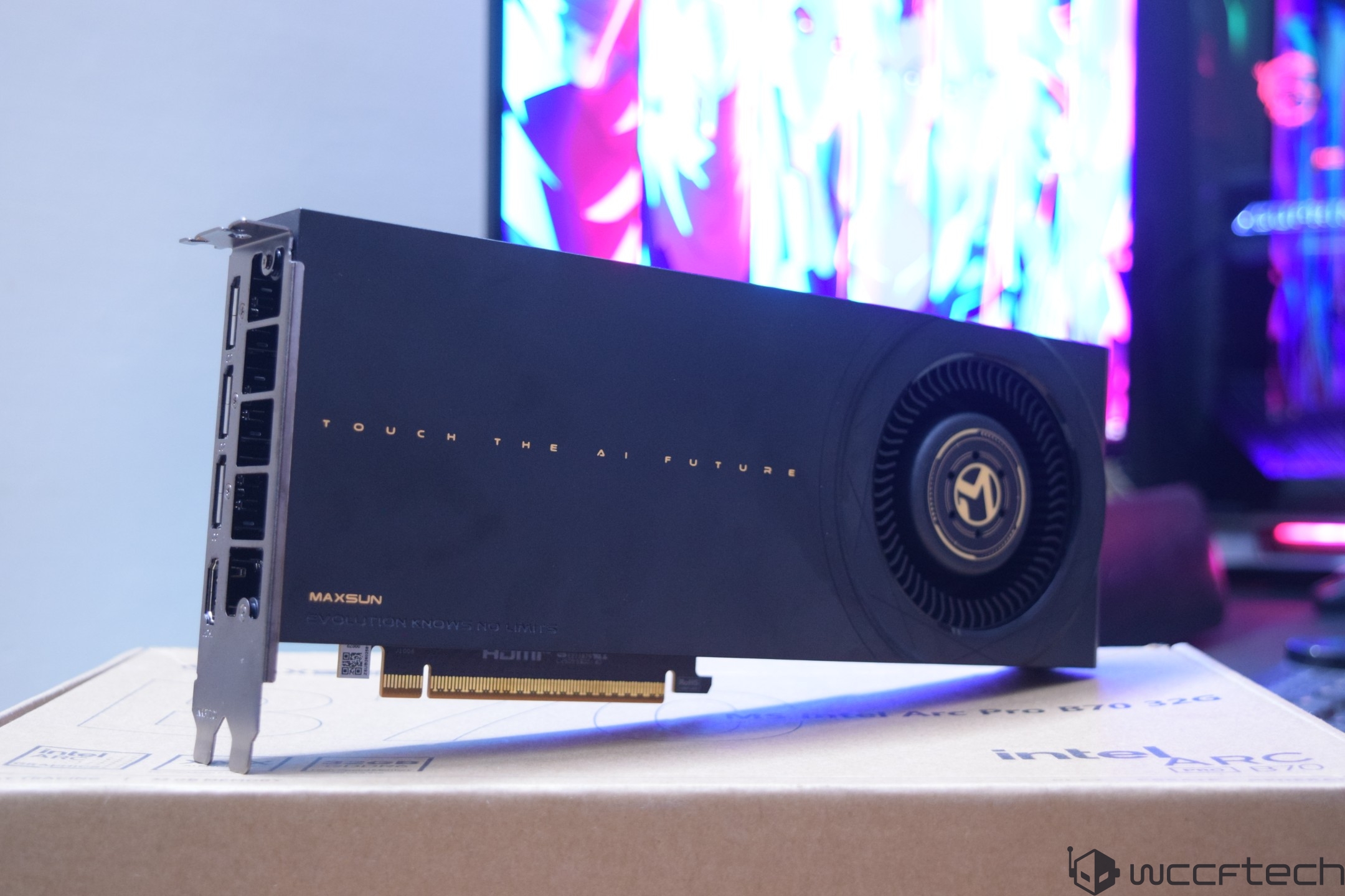 A Maxsun graphics card with the text 'TOUCH THE AI FUTURE' is displayed on top of an Intel Arc Pro B770 box.