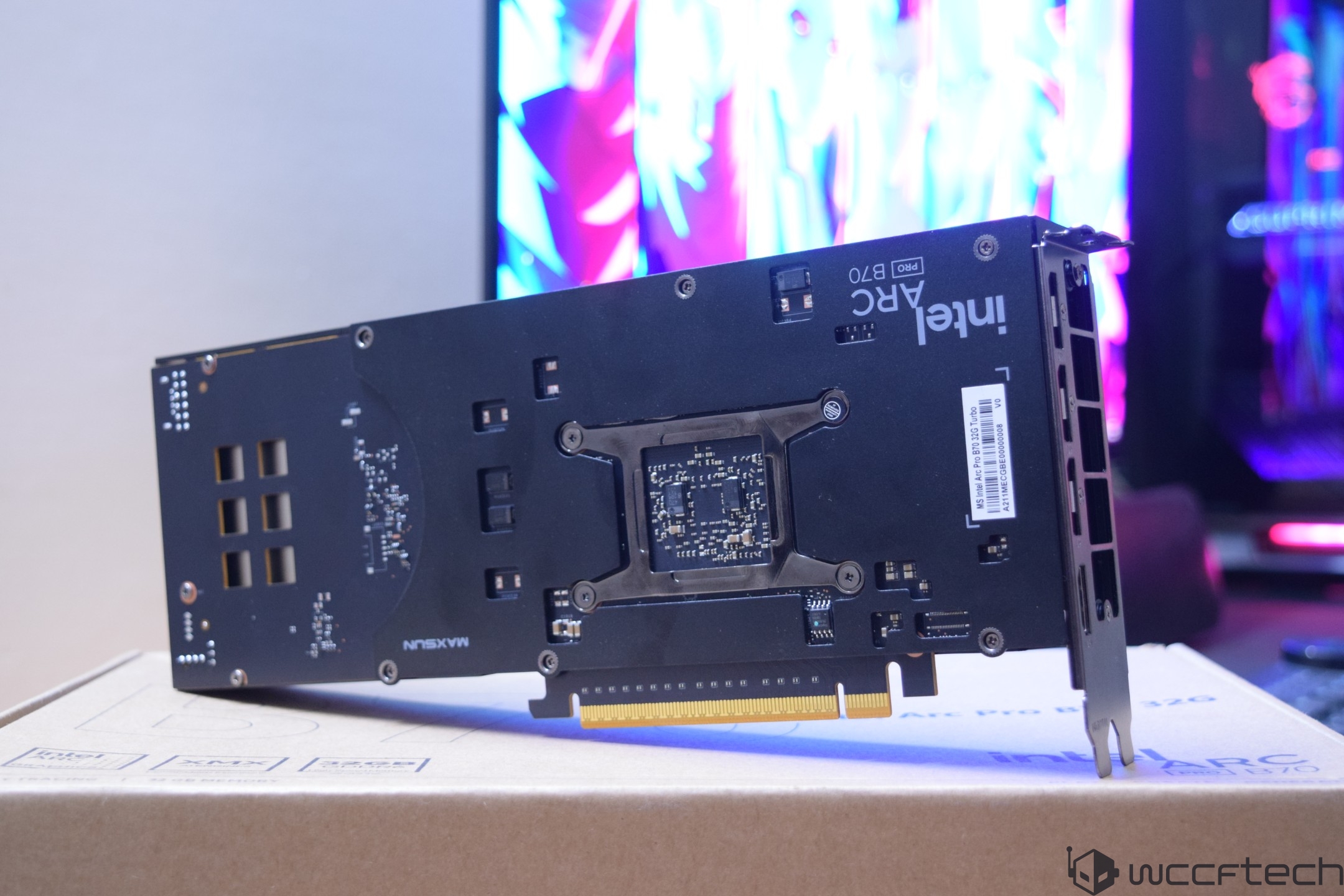 An Intel Arc Pro B760 graphics card is positioned on a box with visible branding and ports facing up.