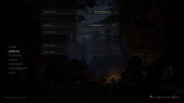 Display settings menu of a video game showing 'WindowedFullscreen' mode, resolution '2560x1440', 'Unlimited Fps' checked, and the option to enable 'VSync' or 'HDR', with a background of a dark forest scene and a campfire.