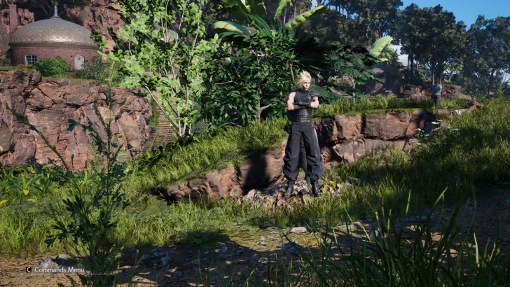 A character from 'Final Fantasy VII Remake' stands in a lush, green landscape with a command menu visible in the lower-left corner.