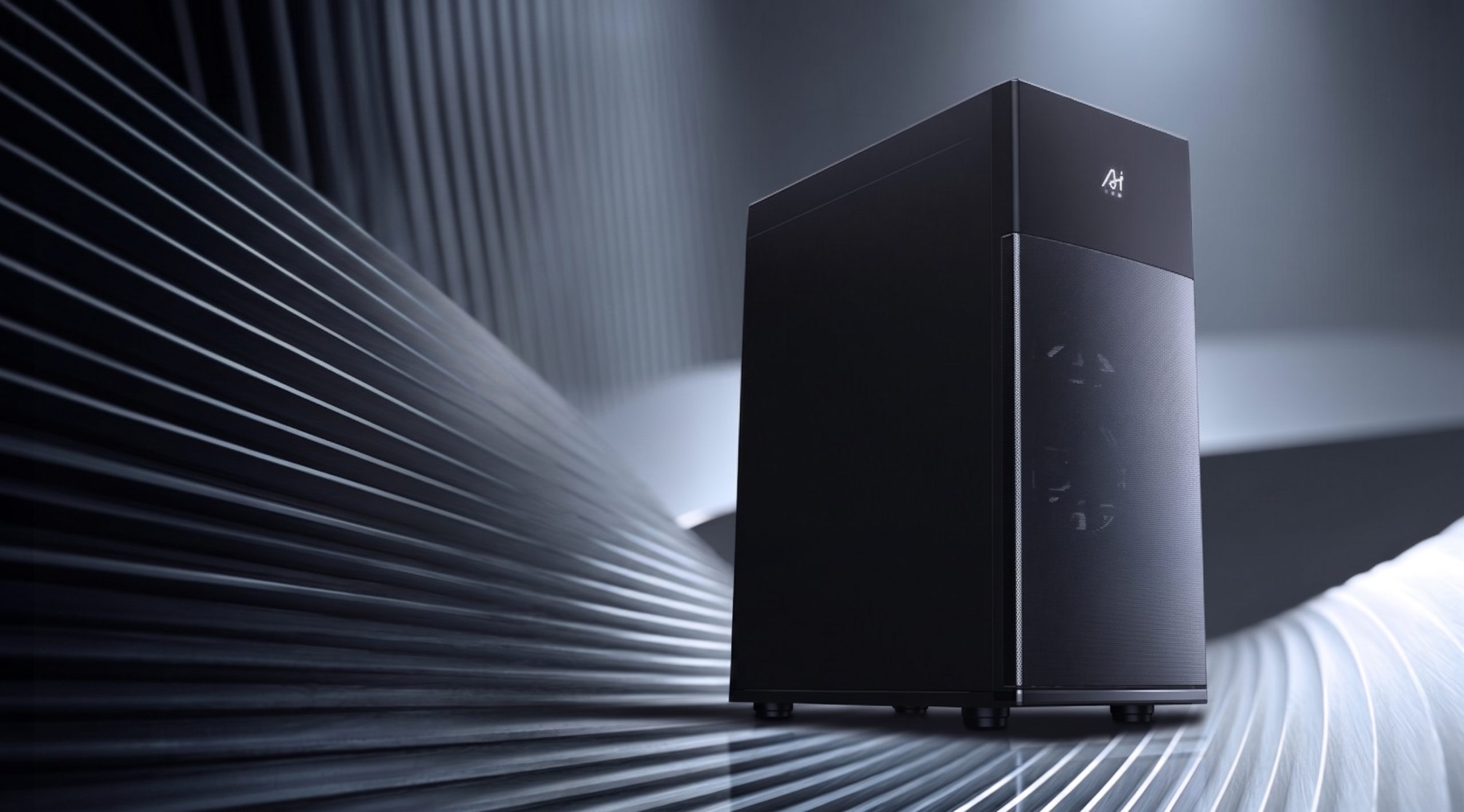 A black Ateez computer case is displayed with a subtle white logo in an abstract, modern setting.