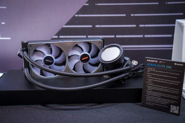 The image shows a GIGABYTE Aorus Elite 240 CPU liquid cooler with dual fans and an illuminated LCD display, next to a product specification card.