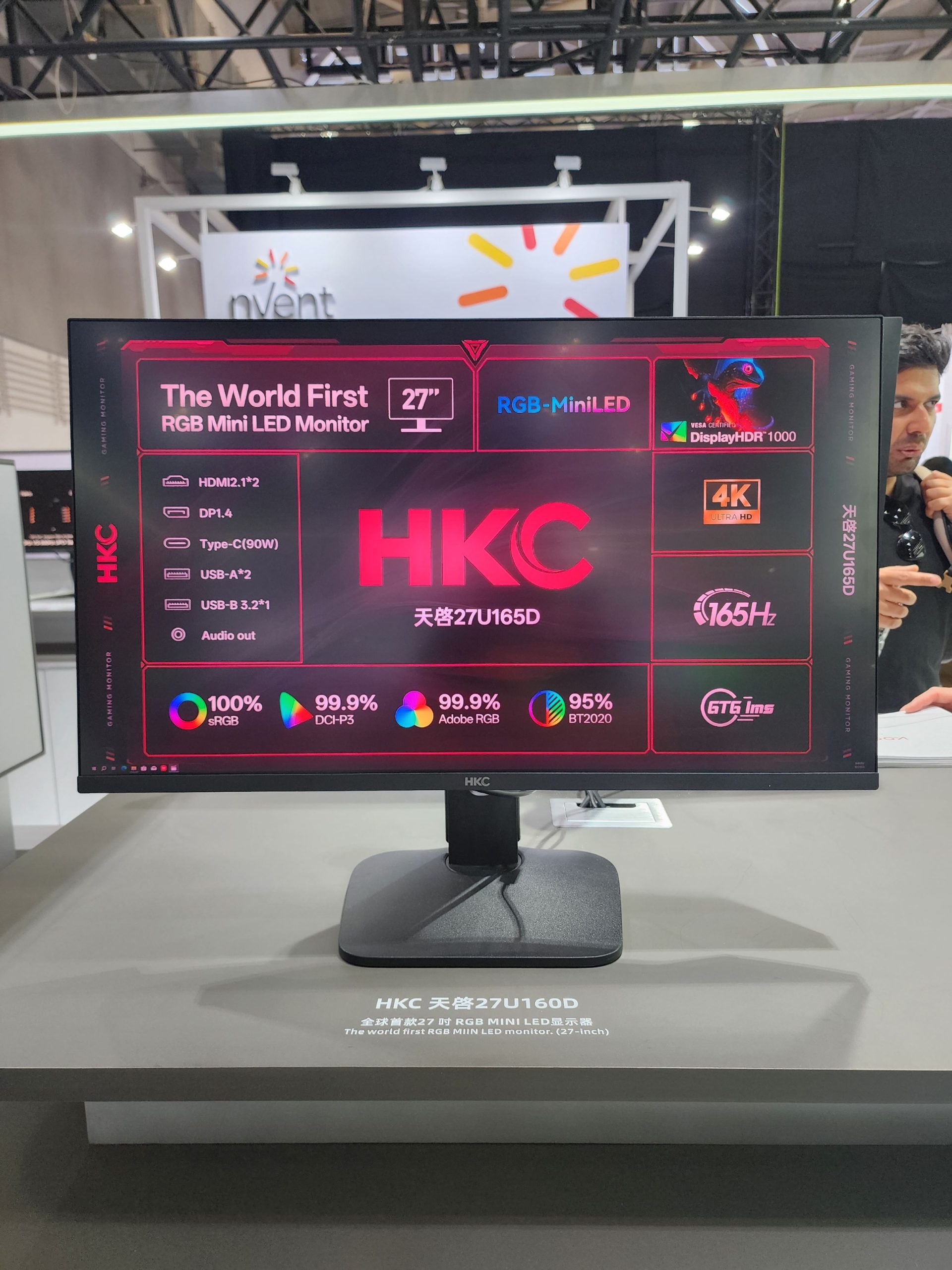The HKC 天睿 27U165D, a 27-inch RGB Mini LED monitor, displays specifications like HDMI 2.1, DisplayPort 1.4, and 165Hz refresh rate, alongside features such as 'DisplayHDR 1000' and '4K Ultra HD.'