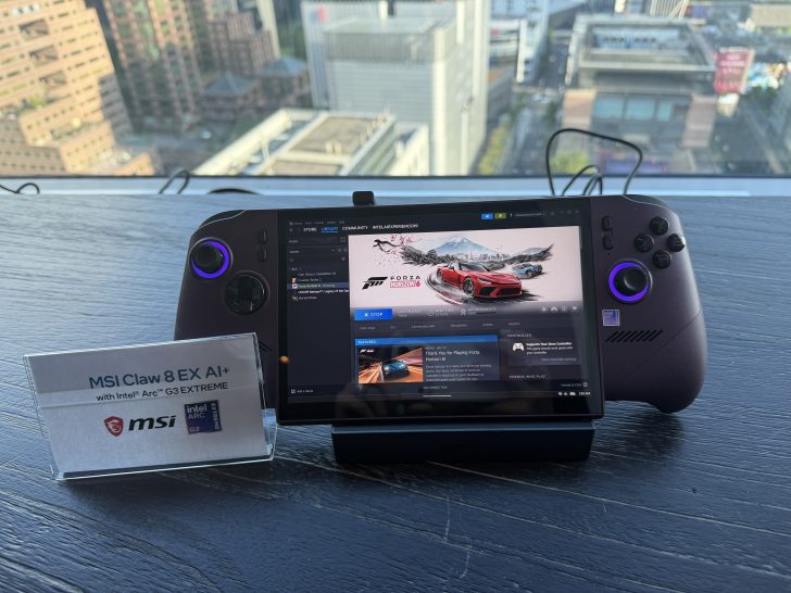 The MSI Claw 8 EX AI+ handheld console with Intel Arc G3 EXTREME is displayed on a table, showing the game 'Forza Horizon 5' on its screen.
