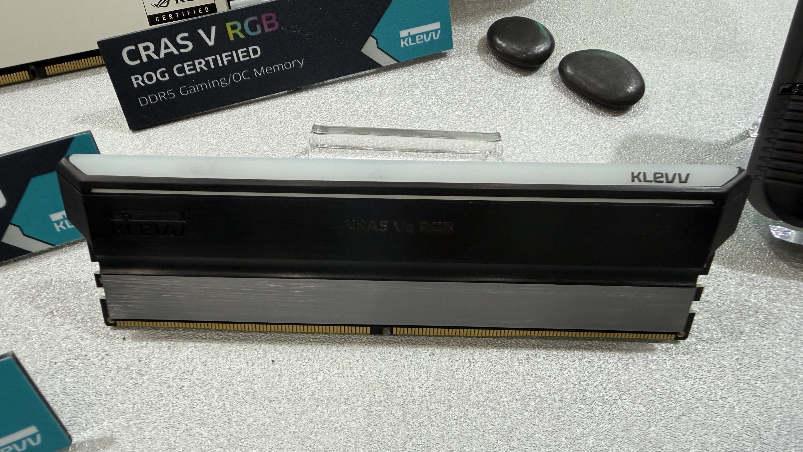 A Klevv CRAS V RGB DDR5 RAM module is displayed with branding and 'ROG Certified' text visible.