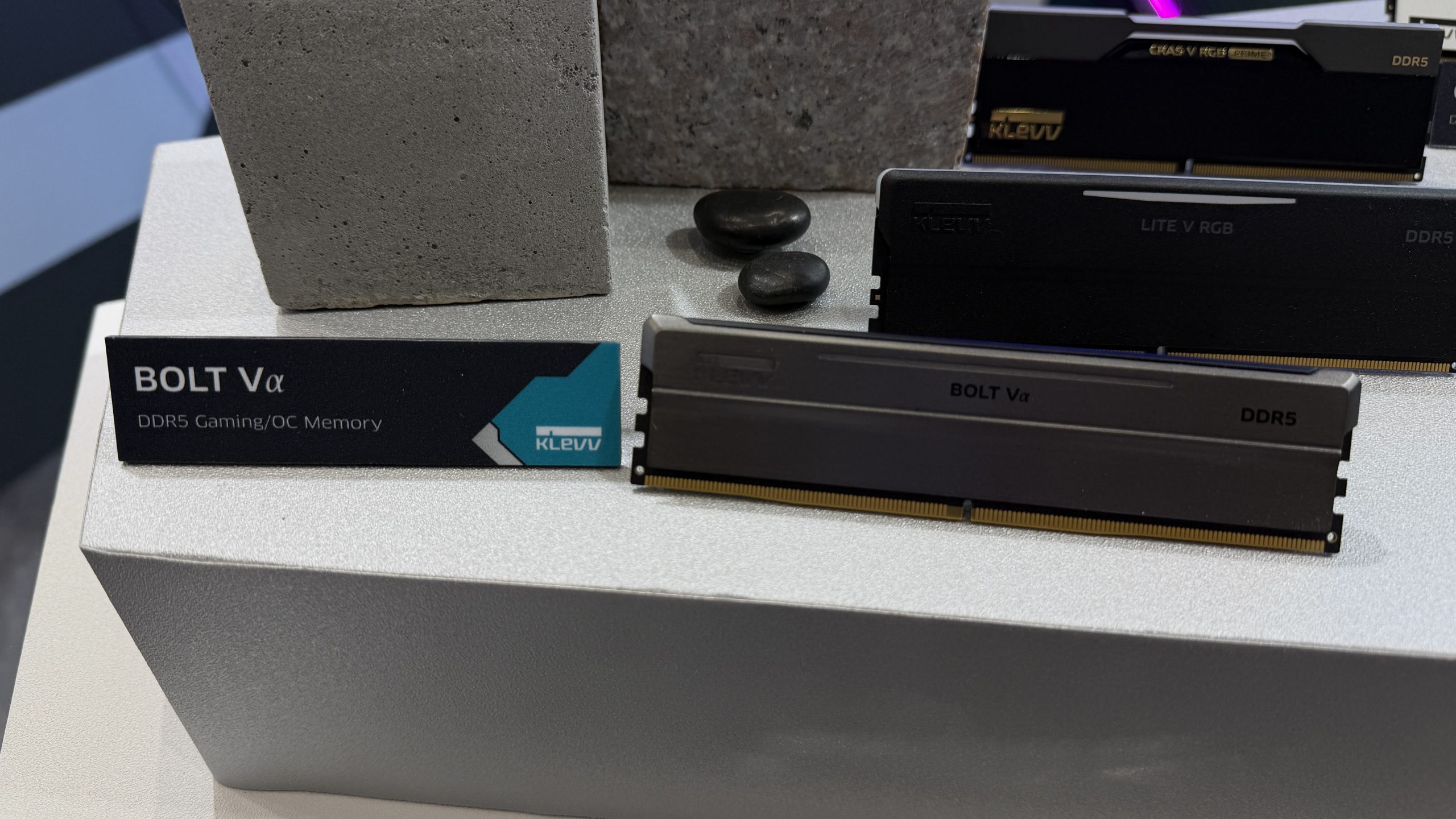 A KLEVV DDR5 memory module labeled 'BOLT Vα' is displayed on a stand with the descriptor 'DDR5 Gaming/OC Memory' beside it.