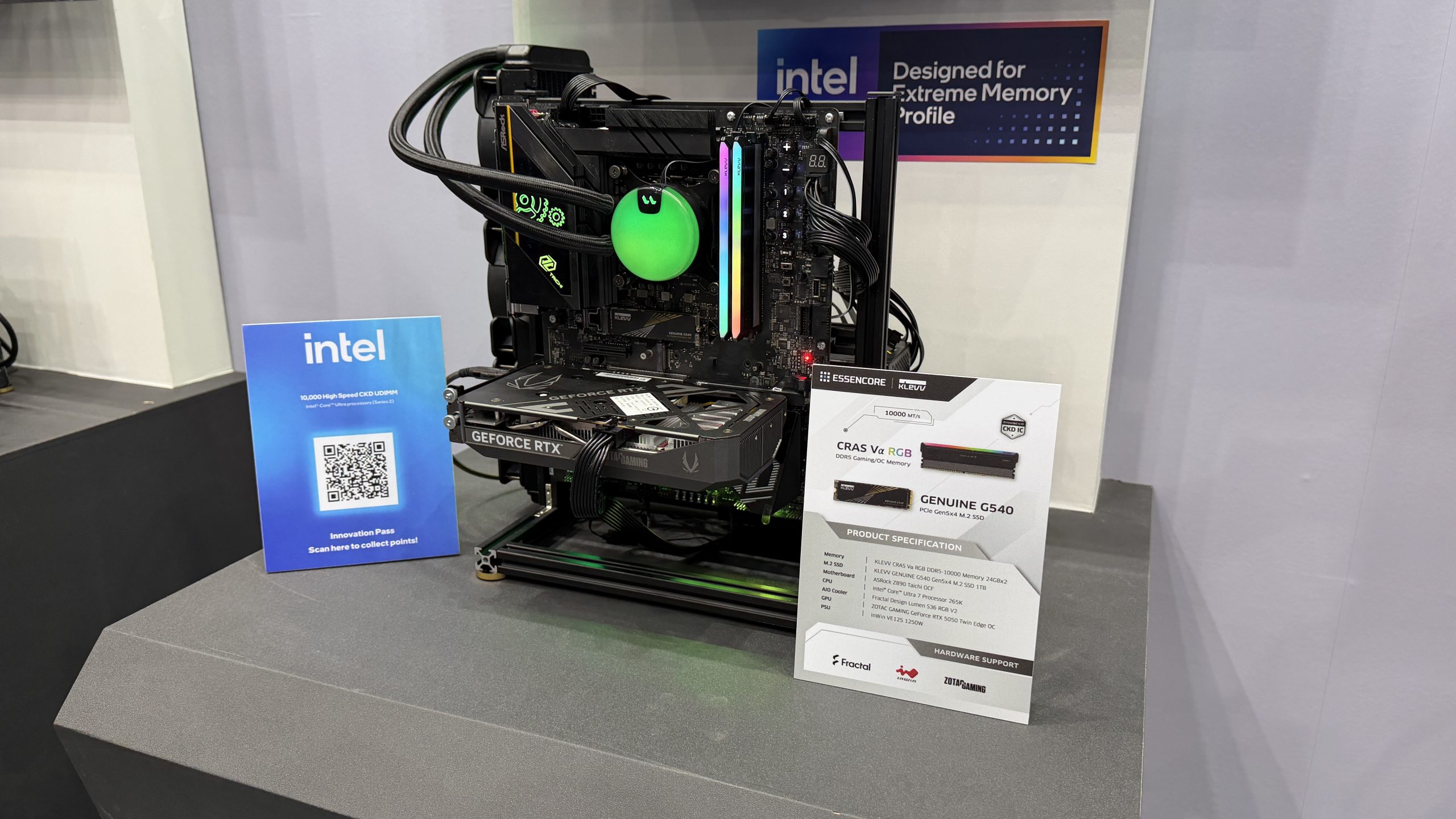 A PC setup featuring an NVIDIA GeForce RTX GPU and Intel components, with an 'intel Designed for Extreme Memory Profile' sign and a display card for KLEVV CRAS V RGB DDR5 Gaming/OC Memory.