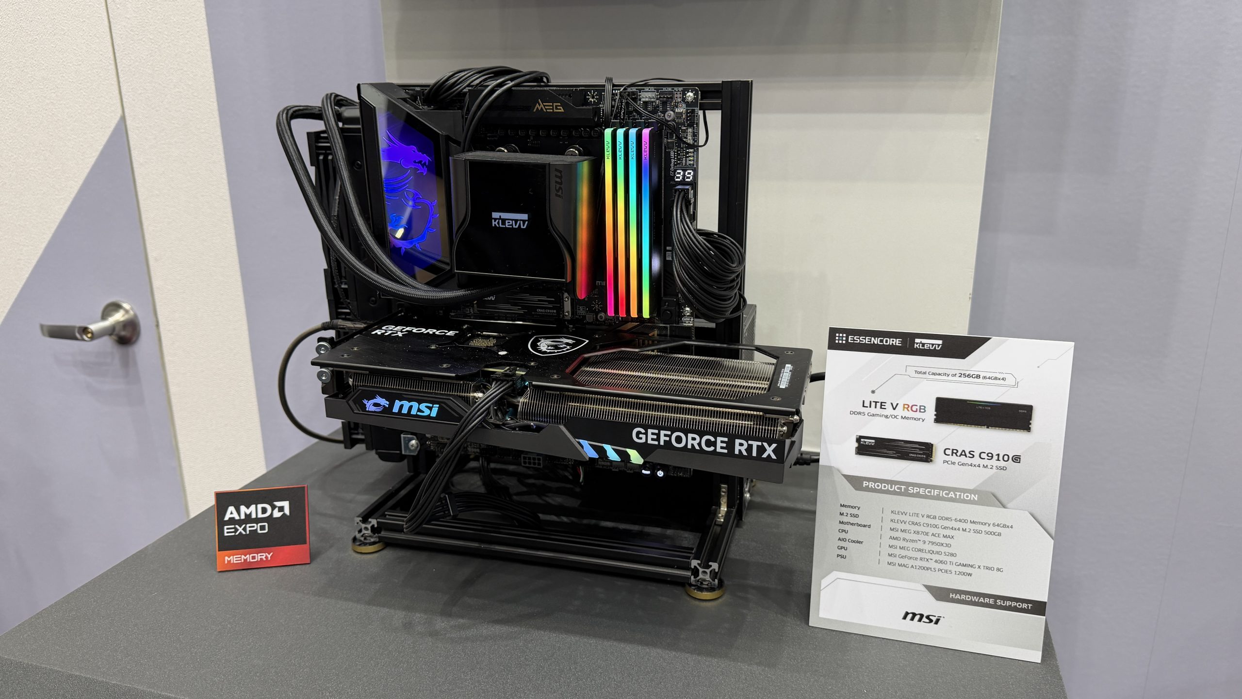 A PC build featuring an MSI GeForce RTX GPU, Klevv DDR5 RGB RAM, and an MSI motherboard, displayed with an AMD Expo memory sign and an ESSENCORE Klevv product information card.