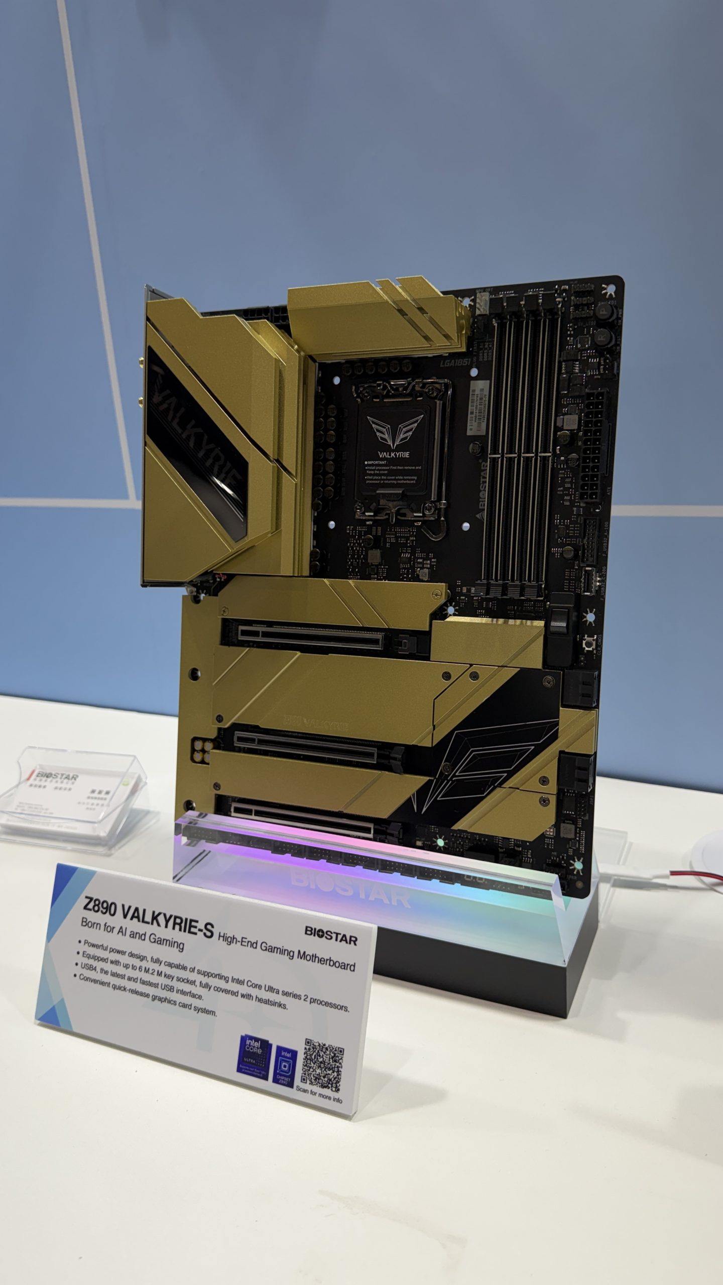 The Biostar Z890 Valkyrie-S high-end gaming motherboard, featuring gold accents and multiple PCIe slots, is displayed with a description card highlighting its support for Intel Core Ultra series 2 processors.
