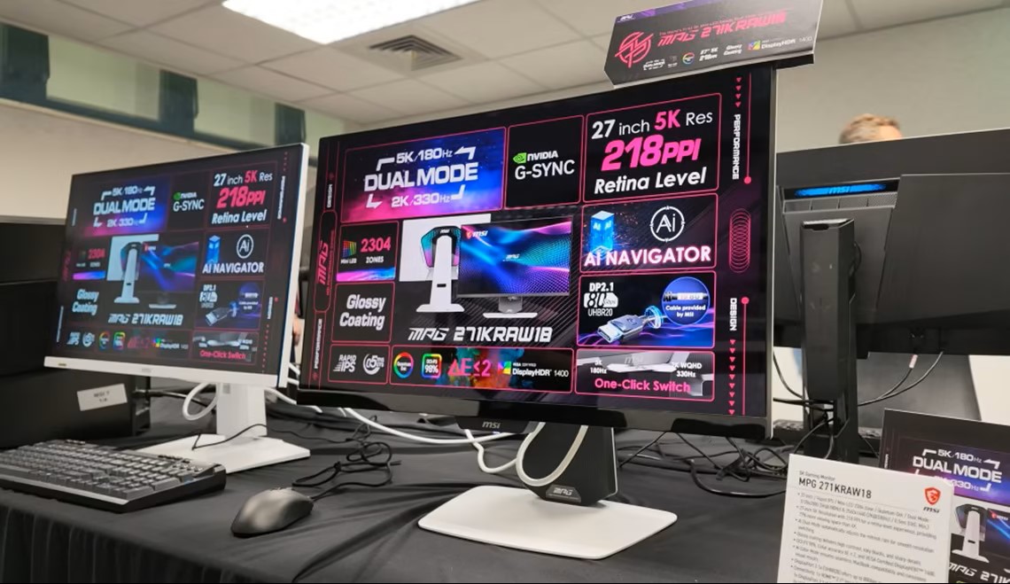 MSI MPG 271KRAW18 monitors display information about '5K 180Hz' and '2K 330Hz' dual mode, '27 inch 5K Res', '218PPI Retina Level', and 'AI Navigator' features, highlighting NVIDIA G-SYNC and a glossy coating.