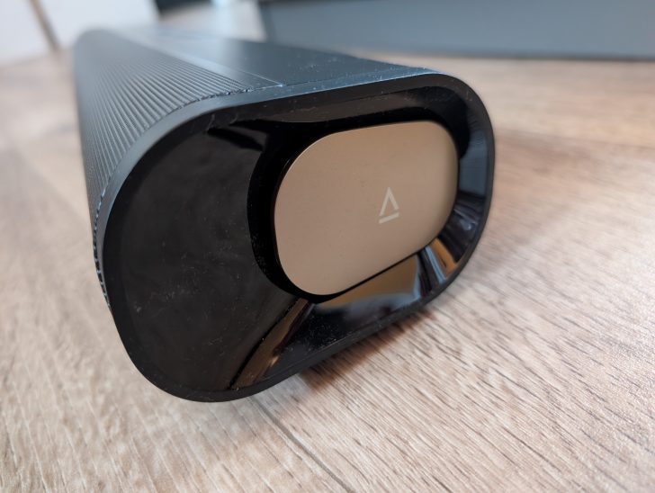 A close-up of the corner of a black Sonos Arc soundbar featuring the Sonos logo.