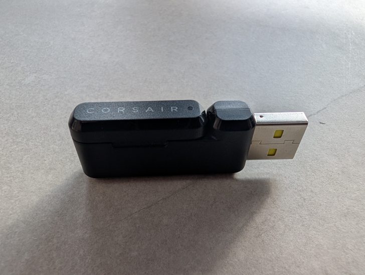 A Corsair USB dongle with a black plastic body and visible USB connector.