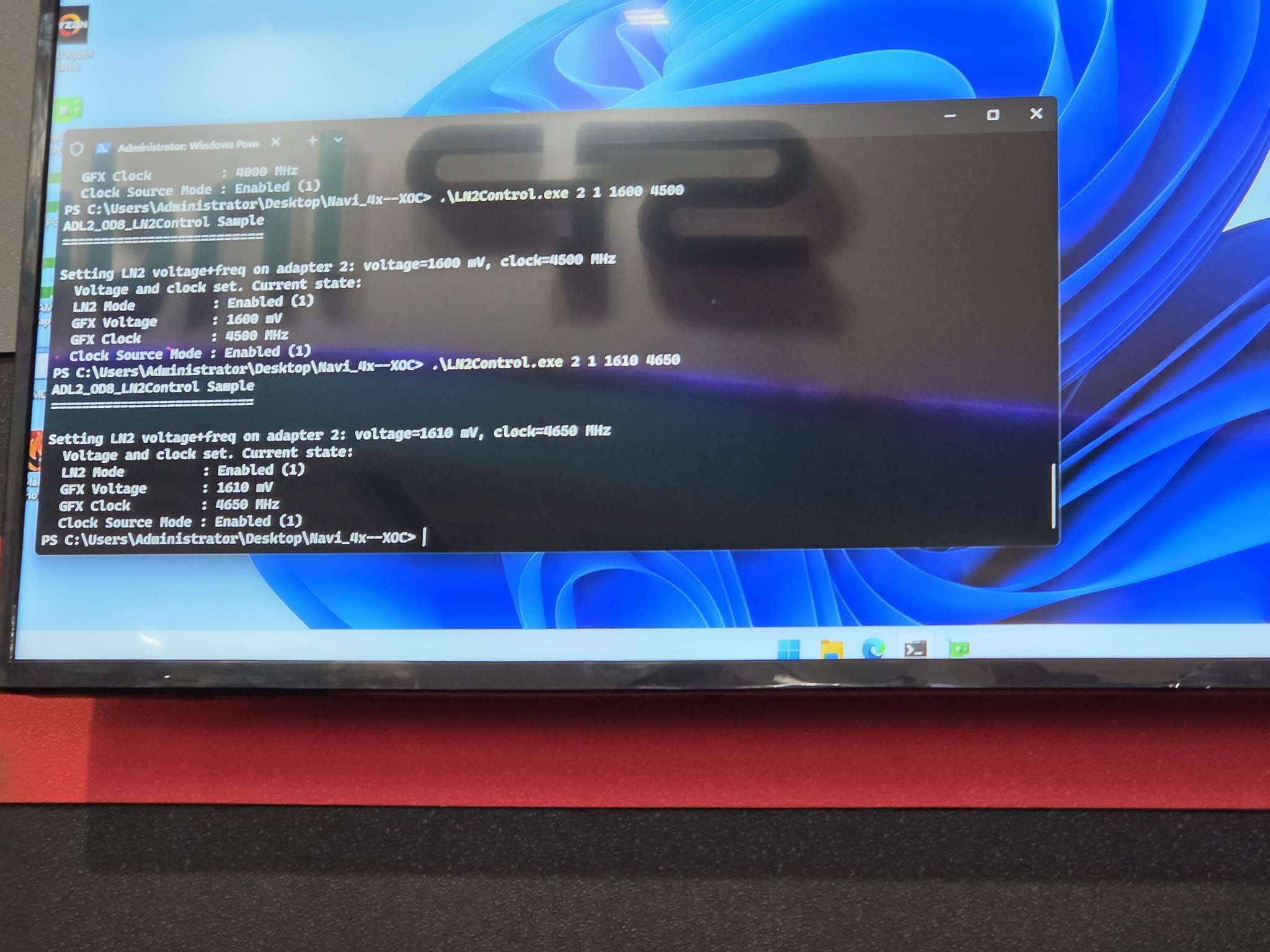 The image shows a Windows PowerShell terminal on a screen running commands to set GFX voltage to 1610 mV and clock to 4650 MHz using '.L1N2control.exe' for adapter 2.