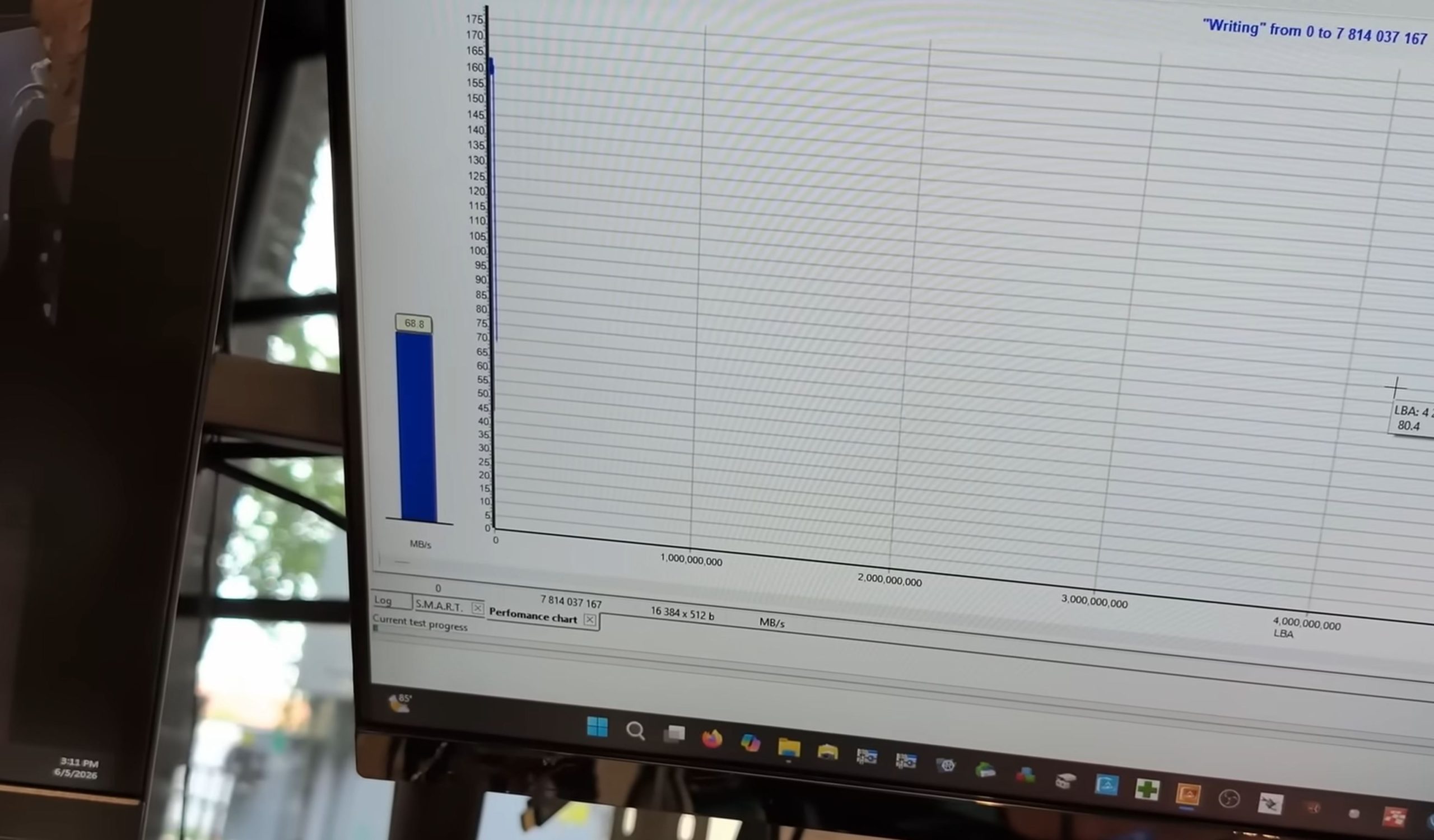 A performance chart on a computer screen displays a data write speed of 68.8 MB/s with the title 'Writing' from 0 to 7,814,037,167.