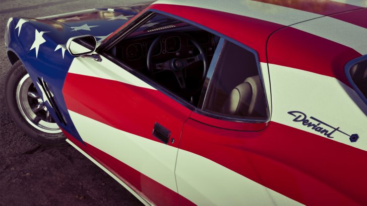 A car with an American flag design on its body and 'Deviant' written on the side, showcasing a classic interior and sleek body lines.