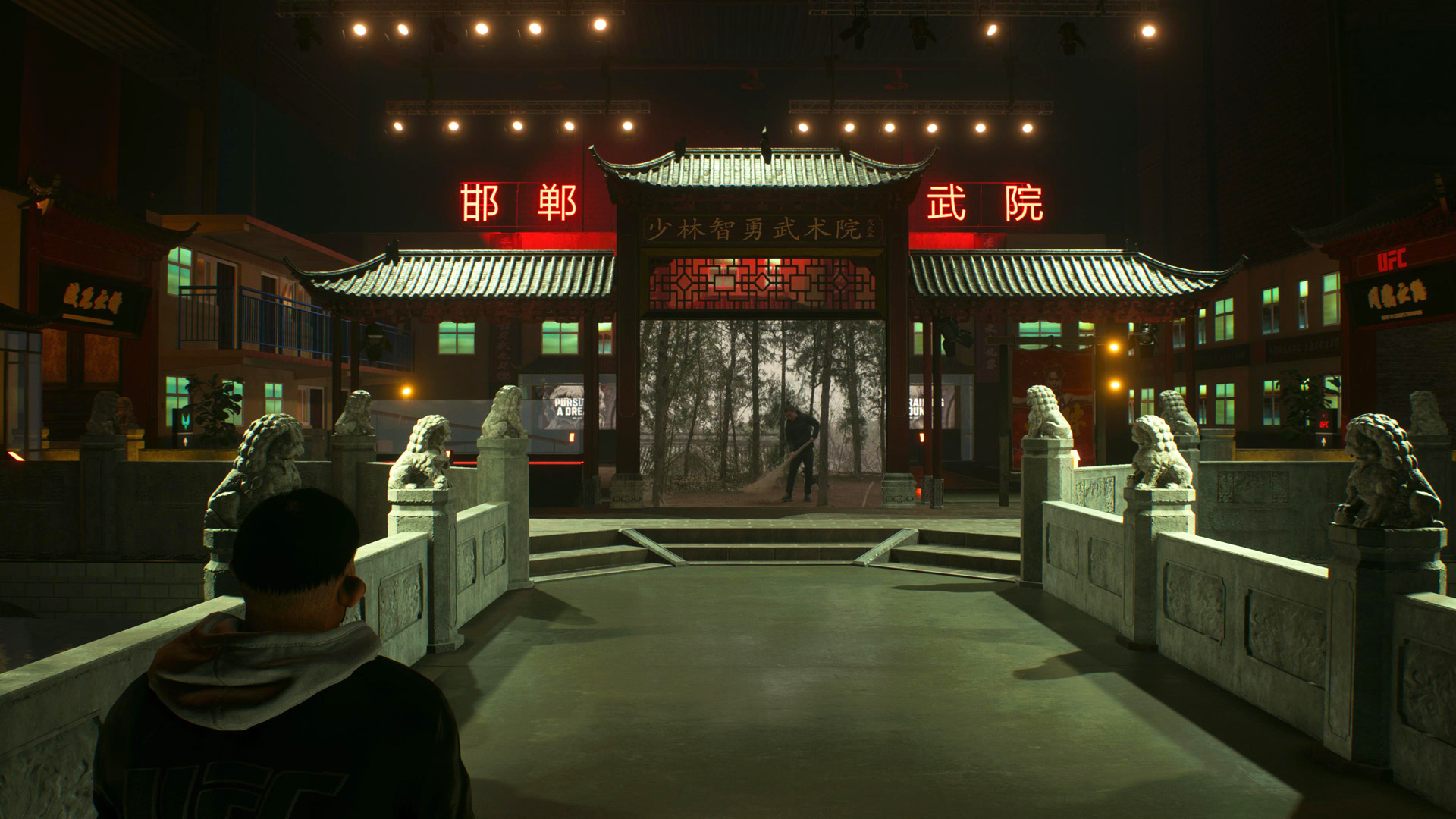 A character in a UFC-branded environment stands on a bridge facing a traditional Chinese building with red neon signs.