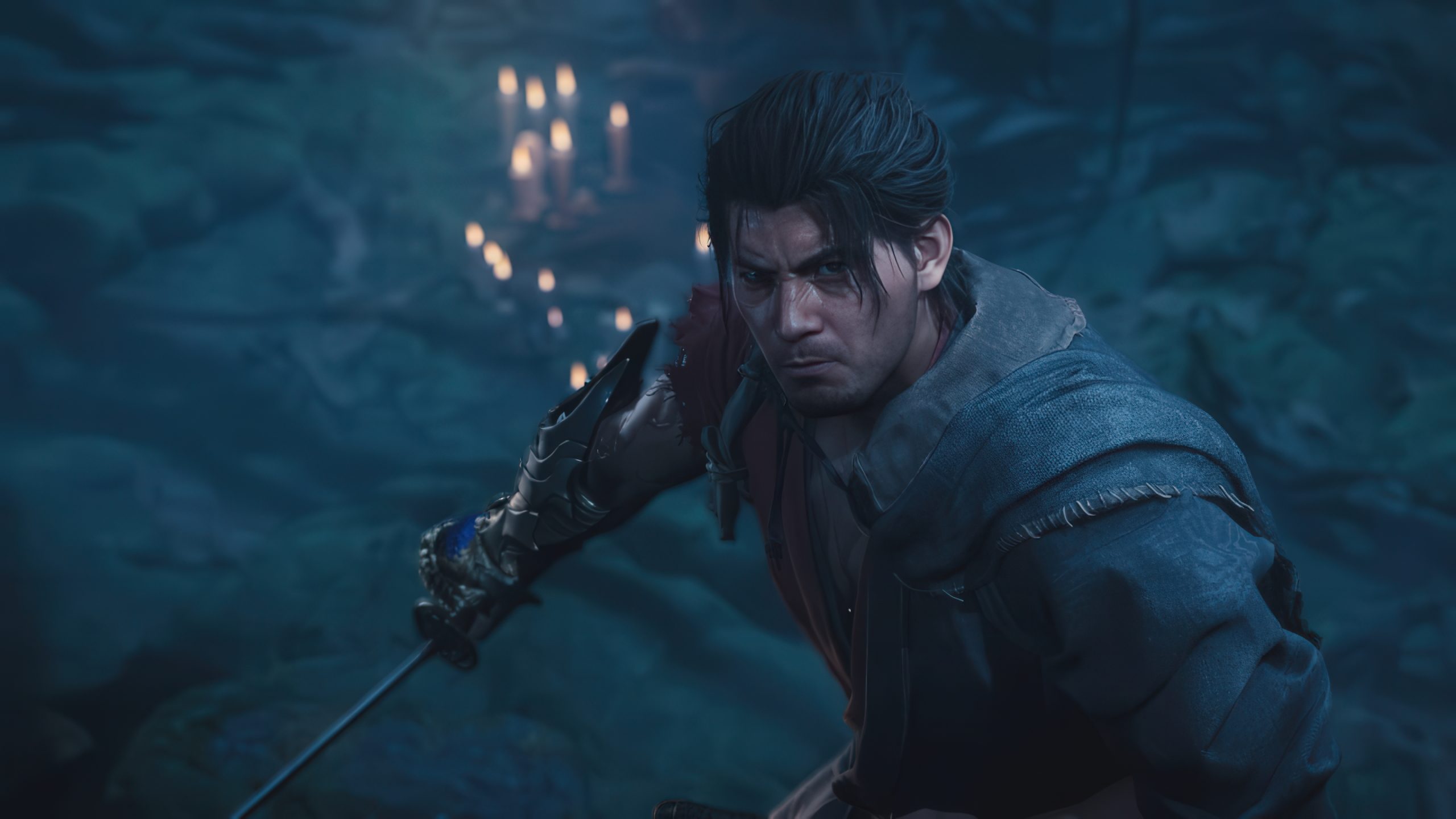 A character in 'Black Myth: Wukong' poised for action with a sword in a dimly lit cave setting.