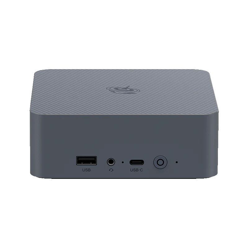 A compact, dark gray ASUS device with a USB port, audio jack, USB-C port, and power button on its front panel.