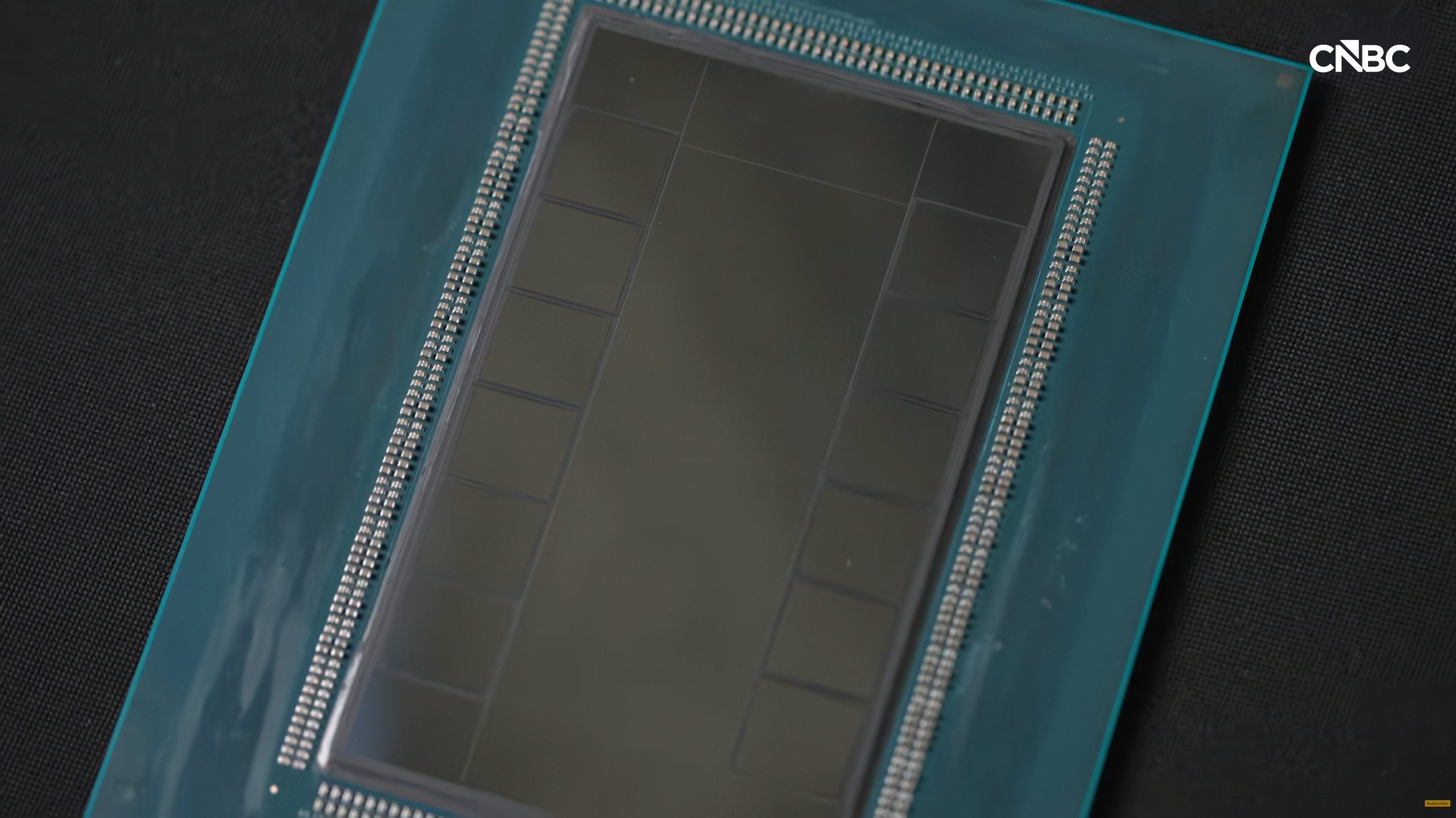 A close-up of a semiconductor chip with a CNBC logo in the corner.