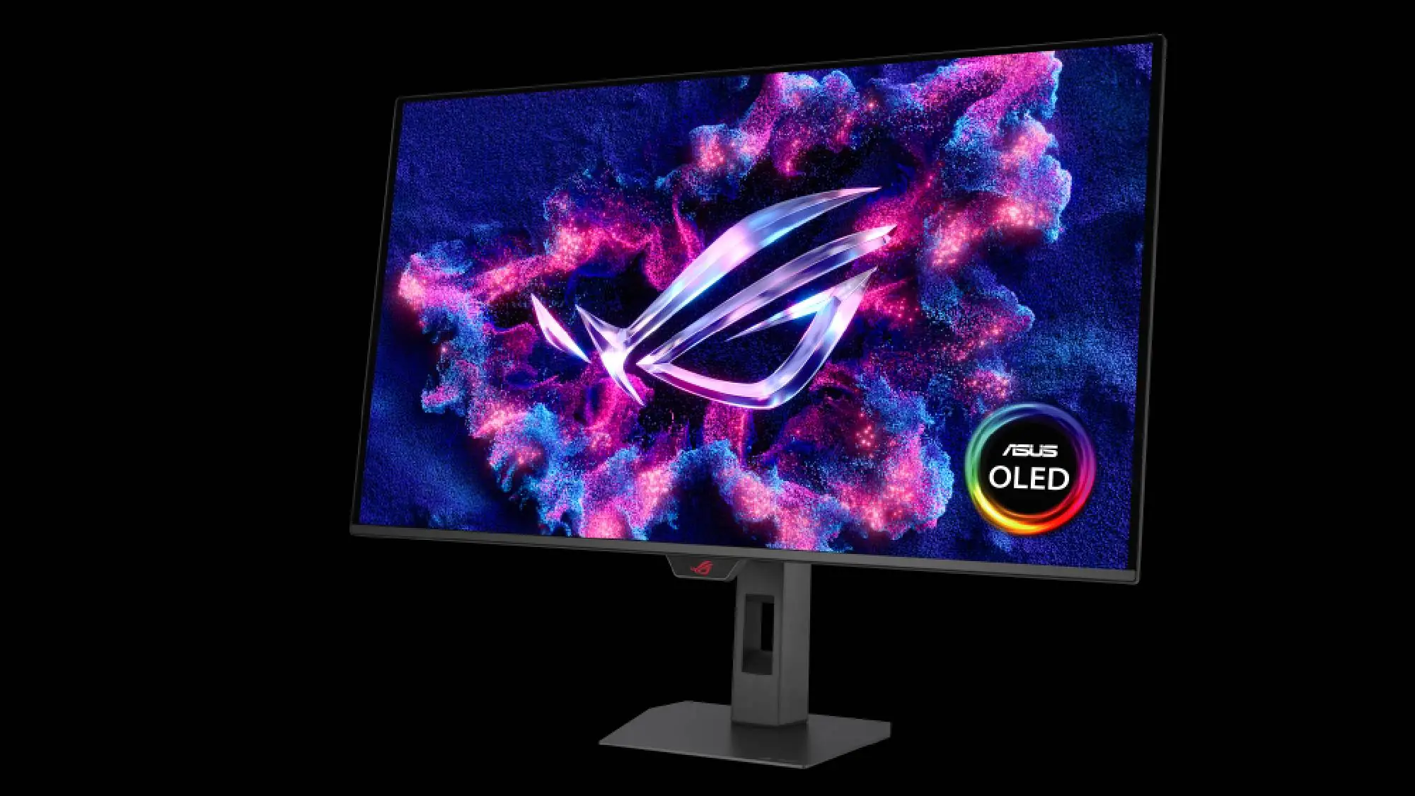 An ASUS OLED monitor displaying the ROG logo on a vibrant, cosmic-themed background.