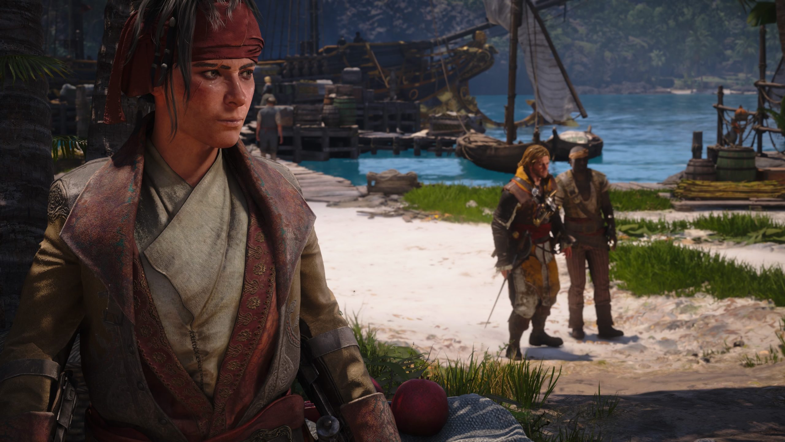 A character in Skull and Bones stands on a beach with ships and two people in the background.
