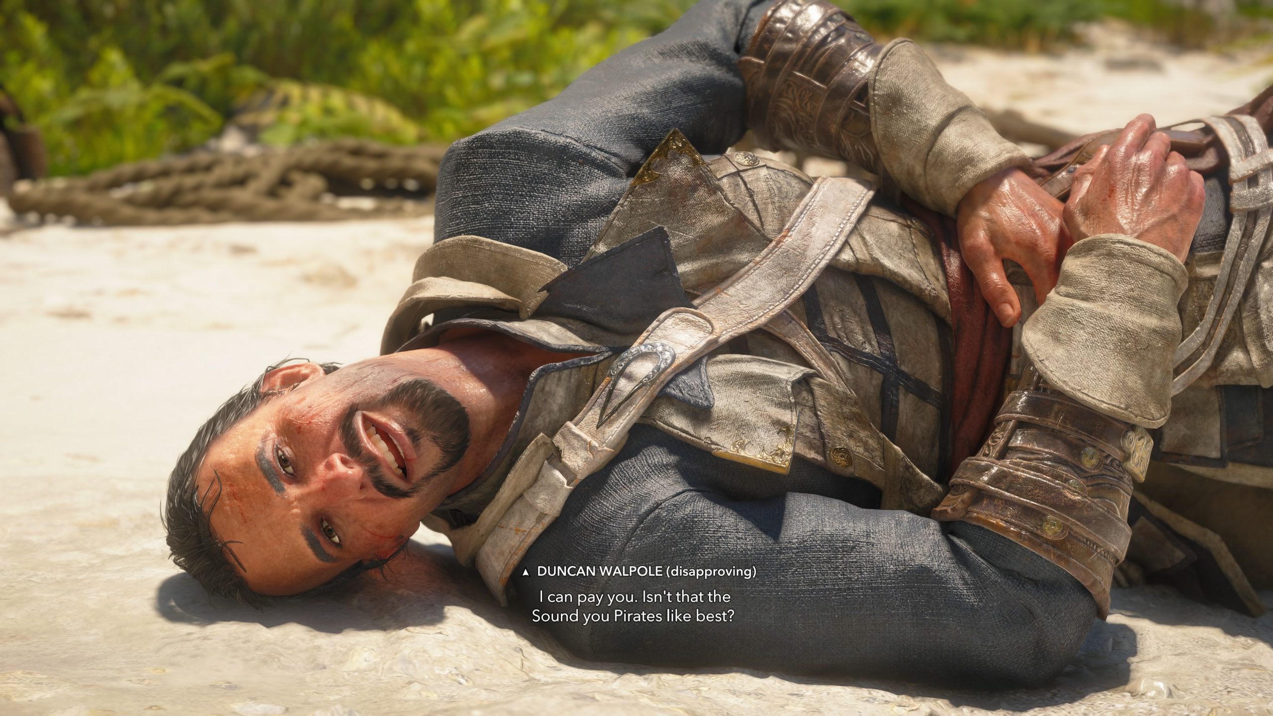 A character from Assassin's Creed IV: Black Flag named Duncan Walpole lying on a beach with dialogue text: I can pay you. Isn't that the Sound you Pirates like best?