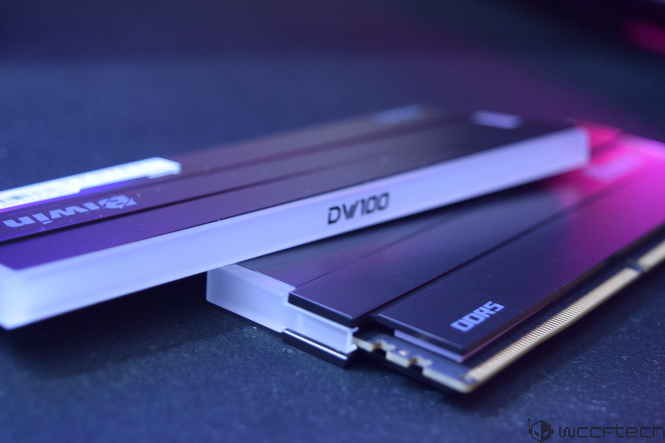 A close-up of two G.Skill memory modules labeled 'DV100' and 'DDR5' on a dark surface.