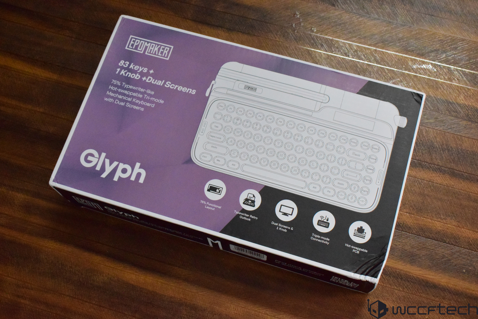 The image shows a boxed Epomaker Glyph mechanical keyboard featuring '83 keys + 1 Knob + Dual Screens,' advertised as a '75% Typewriter-like Hot-swappable Tri-mode Mechanical Keyboard' on the packaging.