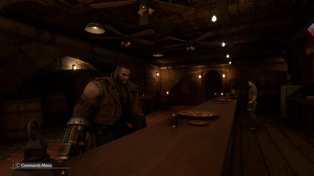 A character from Final Fantasy VII Remake stands at a bar counter inside a dimly lit rustic tavern, with pizzas and drinks on the counter and the 'Commands Menu' visible in the corner.