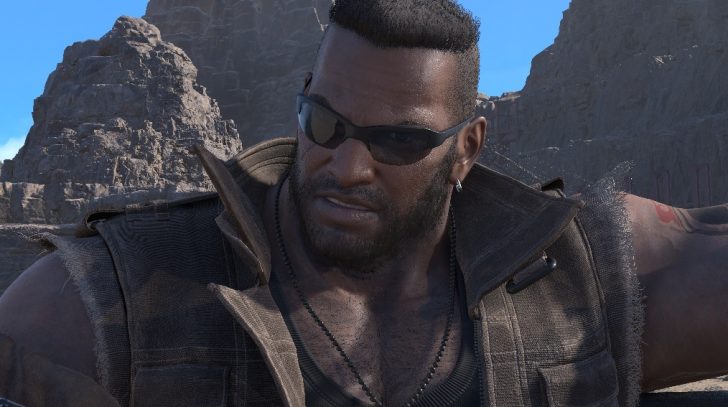 A character from 'Final Fantasy VII Remake Intergrade' stands outdoors with a rocky mountain background.