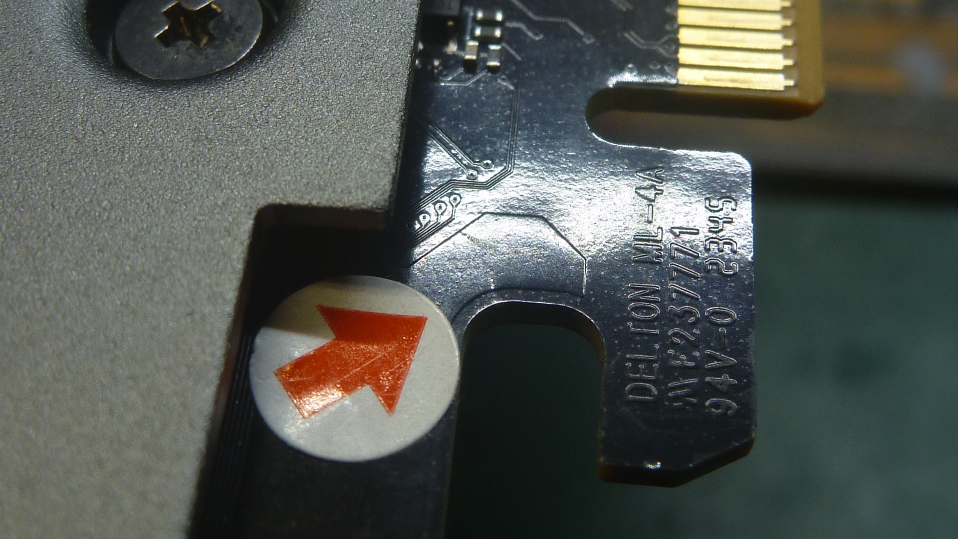 Close-up of a Delton ML-44 expansion card with visible gold contacts and the text 'DELTON ML-44 A4/G V2.3/77'.