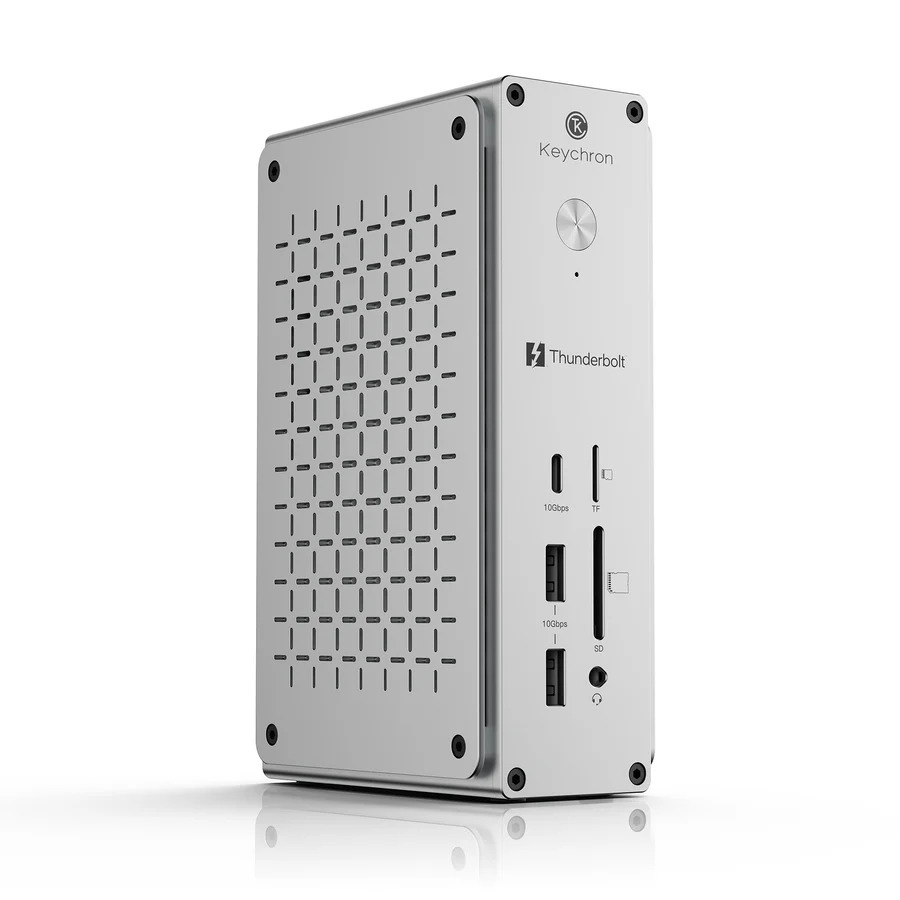A Keychron Thunderbolt docking station features multiple ports, including USB-C labeled '10Gbps', TF, SD, and additional USB slots.