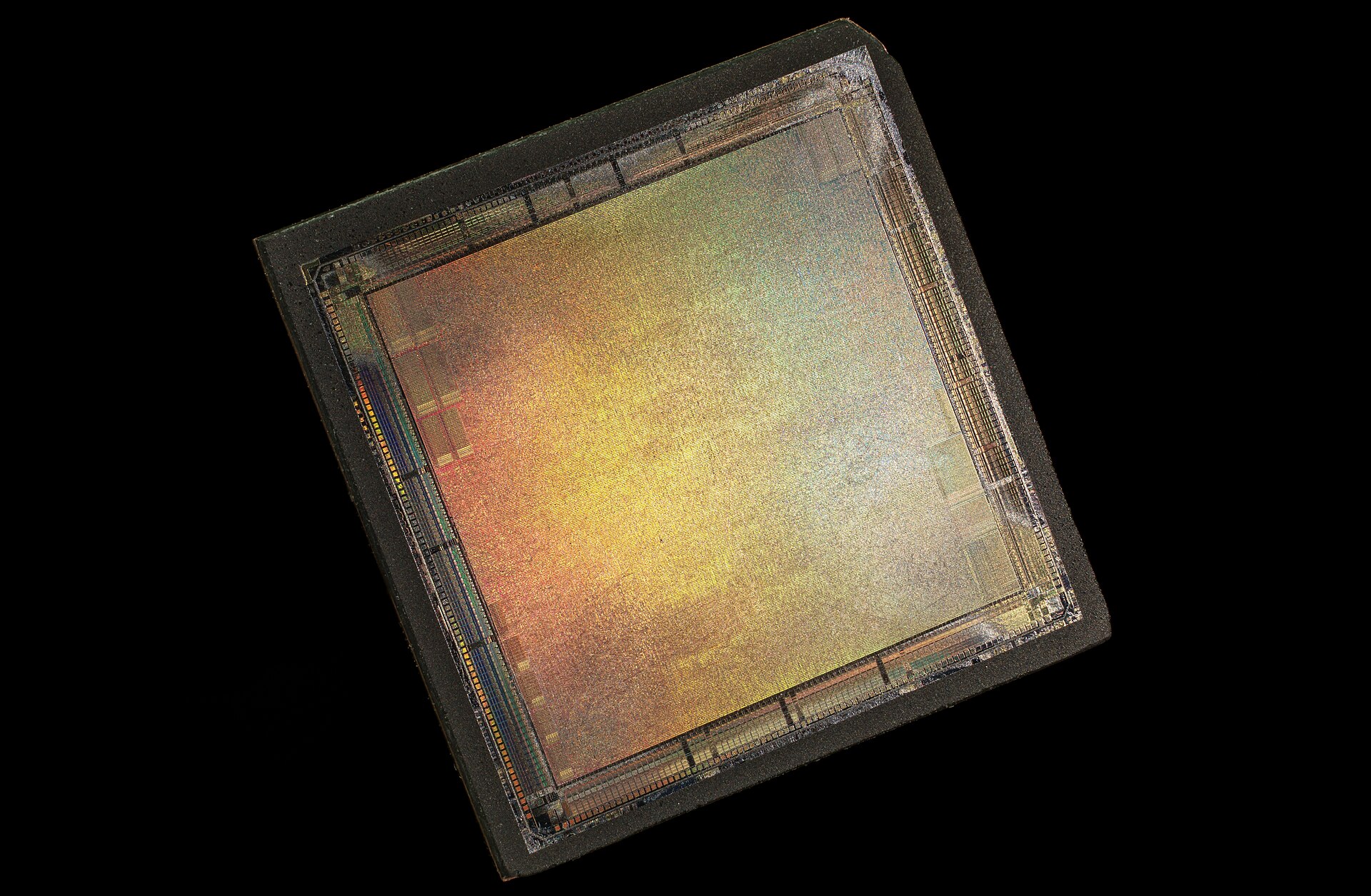 A close-up image of an unbranded semiconductor chip, showcasing its intricate circuitry and metallic surface.