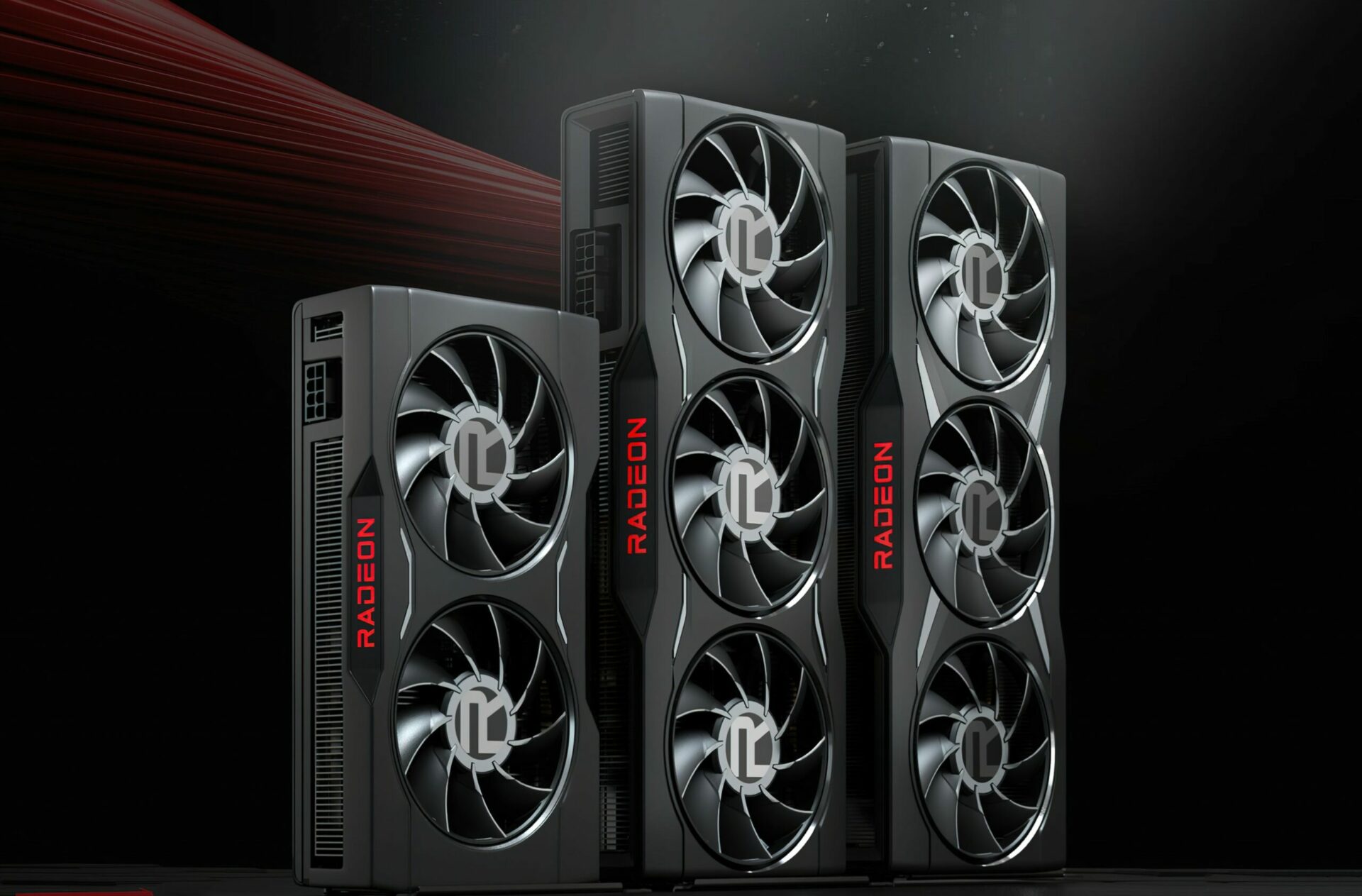 Three AMD Radeon graphics cards with large cooling fans and 'RADEON' branding are displayed against a dark background.