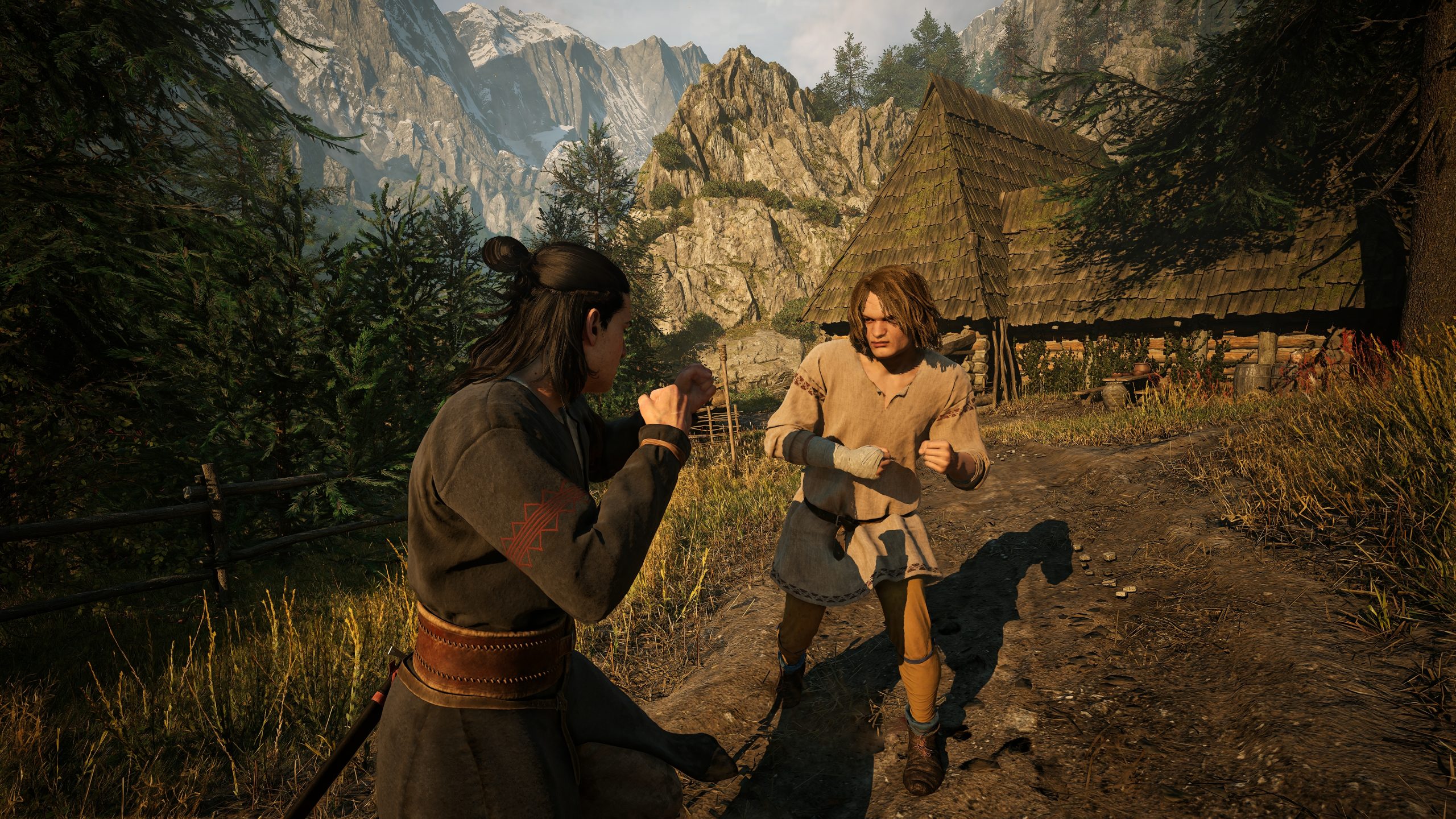 Two characters in a medieval-style setting are preparing to fight in a mountainous landscape with a rustic wooden house in the background, likely from a video game.