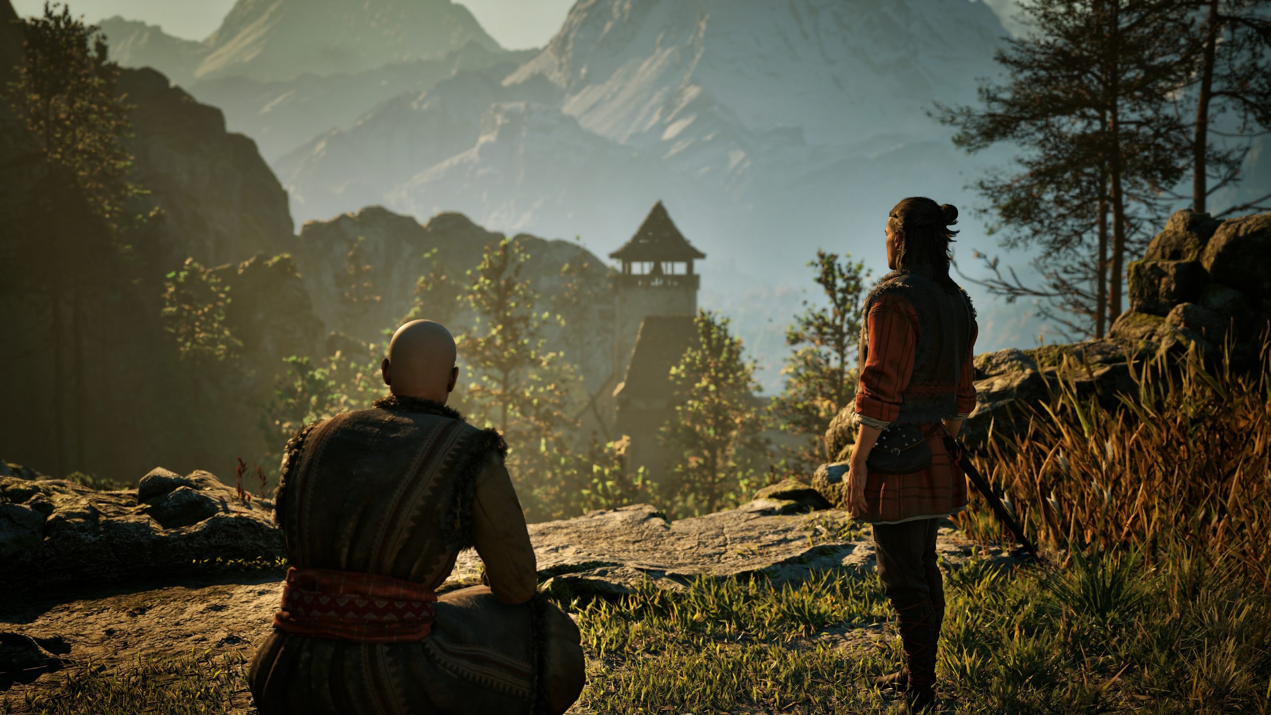 Two characters overlook a landscape with a tower in the distance in the game 'Baldur's Gate 3'.