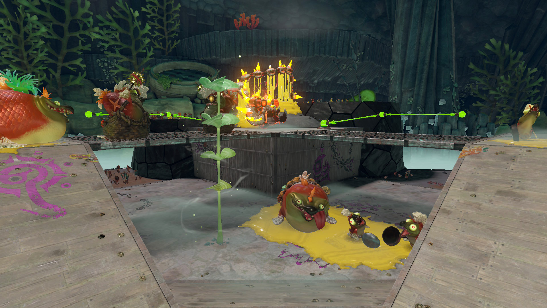 Characters from Ratchet & Clank engage with frog-like creatures and a fiery contraption in an underground aquatic setting.