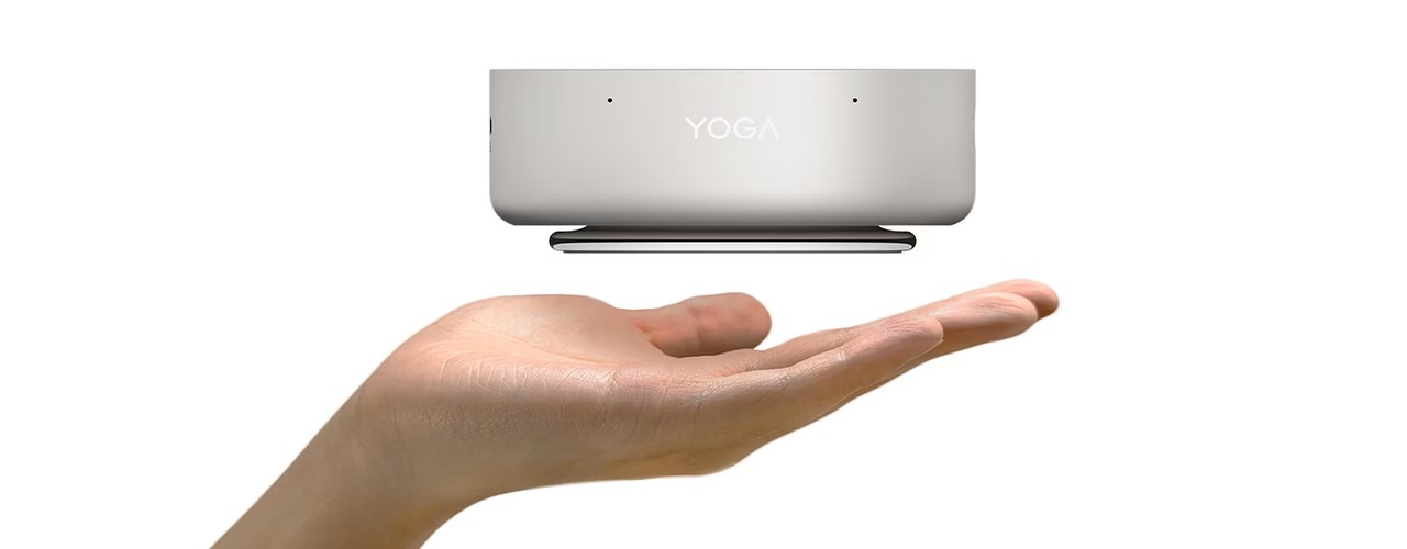 A Lenovo YOGA device levitating above a person's hand.