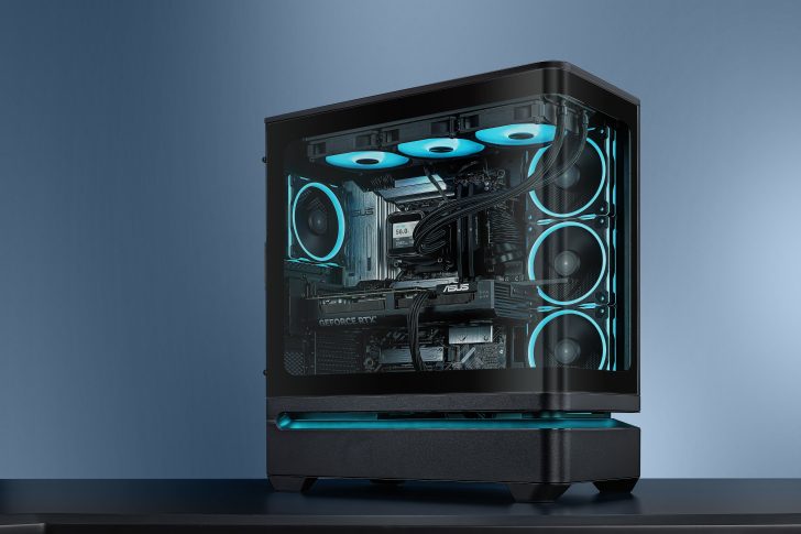 A custom-built PC with an ASUS motherboard and a GeForce RTX GPU is visible through a transparent side panel, featuring blue LED cooling fans and a liquid cooling system.
