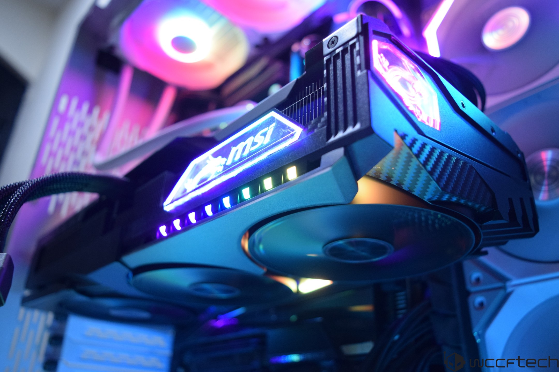 An MSI graphics card with RGB lighting is installed in a desktop computer setup.
