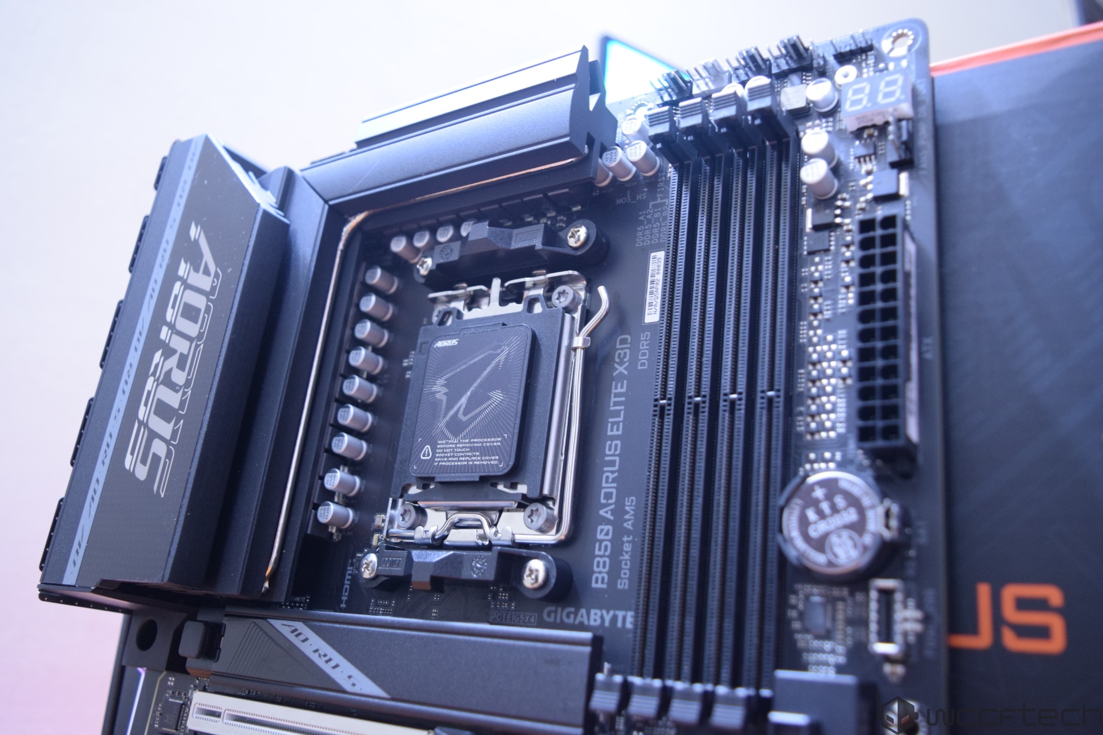 A GIGABYTE B650 AORUS ELITE X3D motherboard with visible DDR5 RAM slots and the socket labeled 'Socket AM5'.